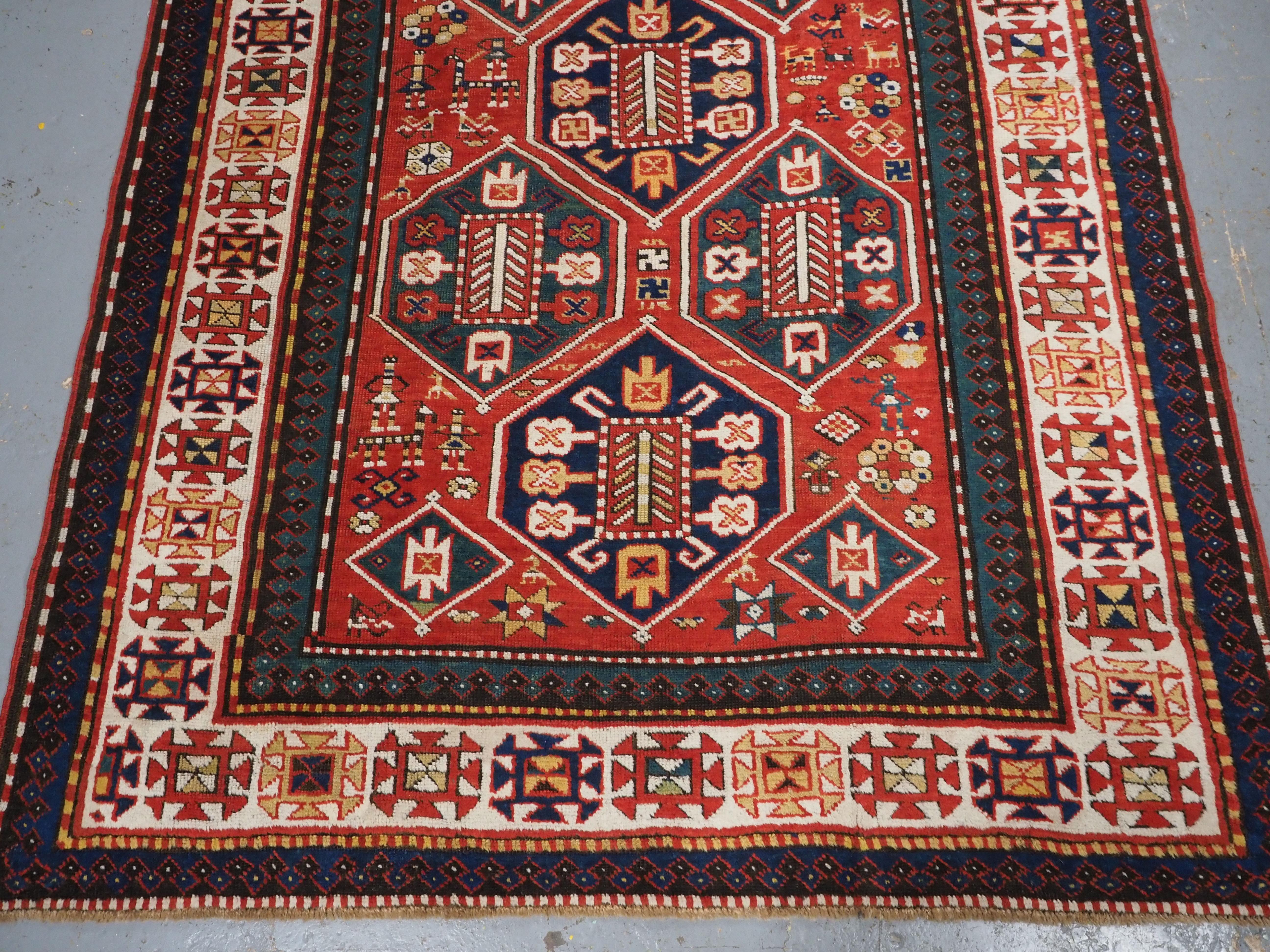 Late 19th Century Antique Caucasian Gendje rug with wonderful folk art design.  Circa 1890. For Sale