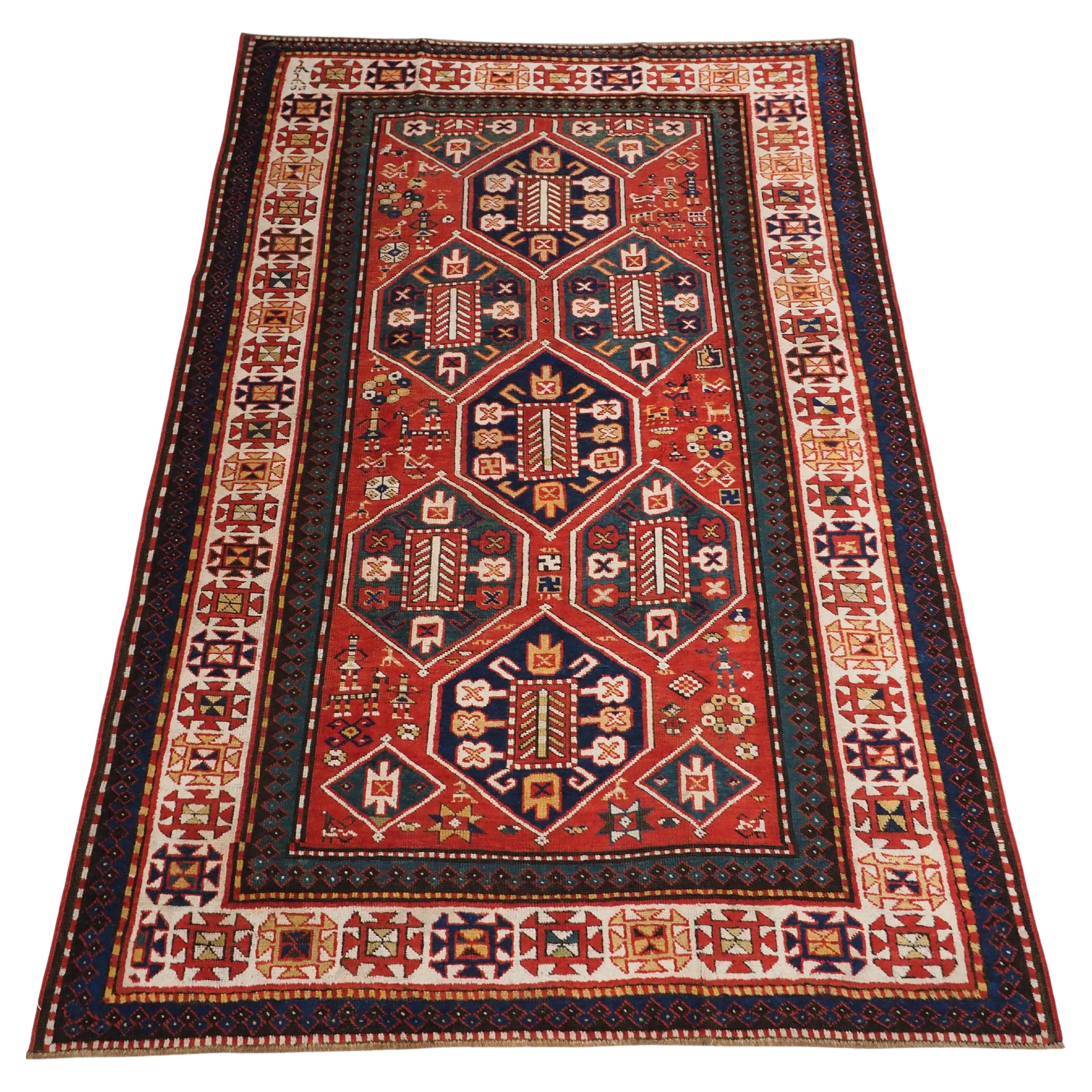 Antique Caucasian Gendje rug with wonderful folk art design.  Circa 1890. For Sale