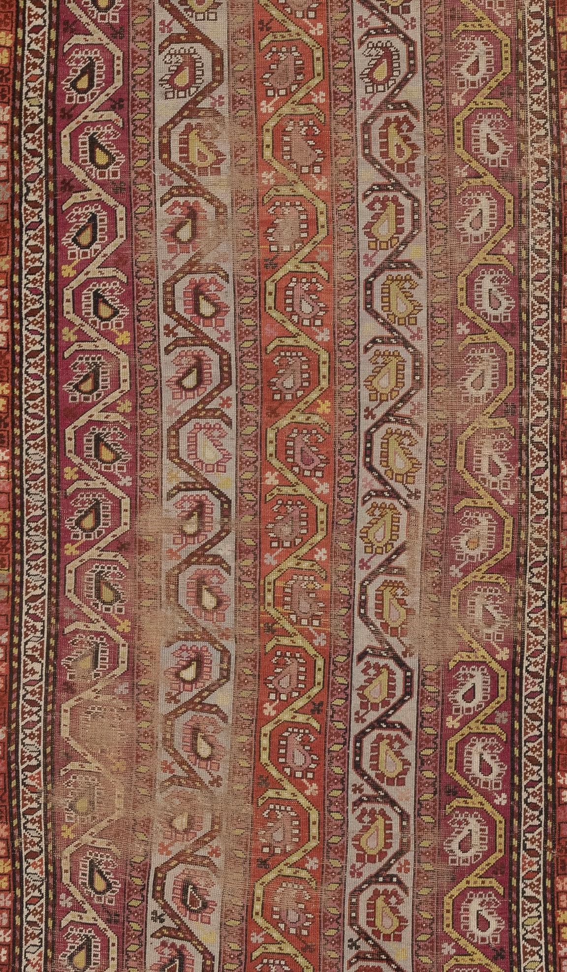 Antique Caucasian Karabagh is a type of traditional rug or carpet that originated in the Karabagh region of the Caucasus Mountains, which spans parts of modern-day Azerbaijan and Armenia. These rugs are known for their bold and vibrant colors,