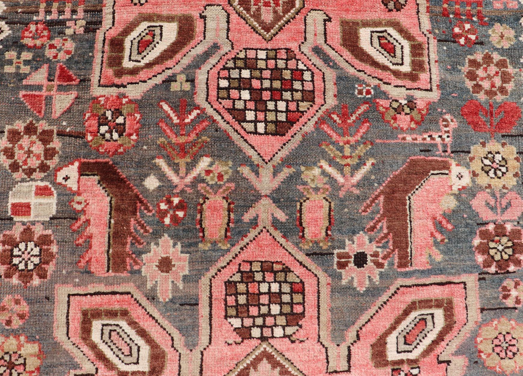 Wool Antique Caucasian Karabagh Gallery Runner With Large Medallions Of Pink And Red For Sale