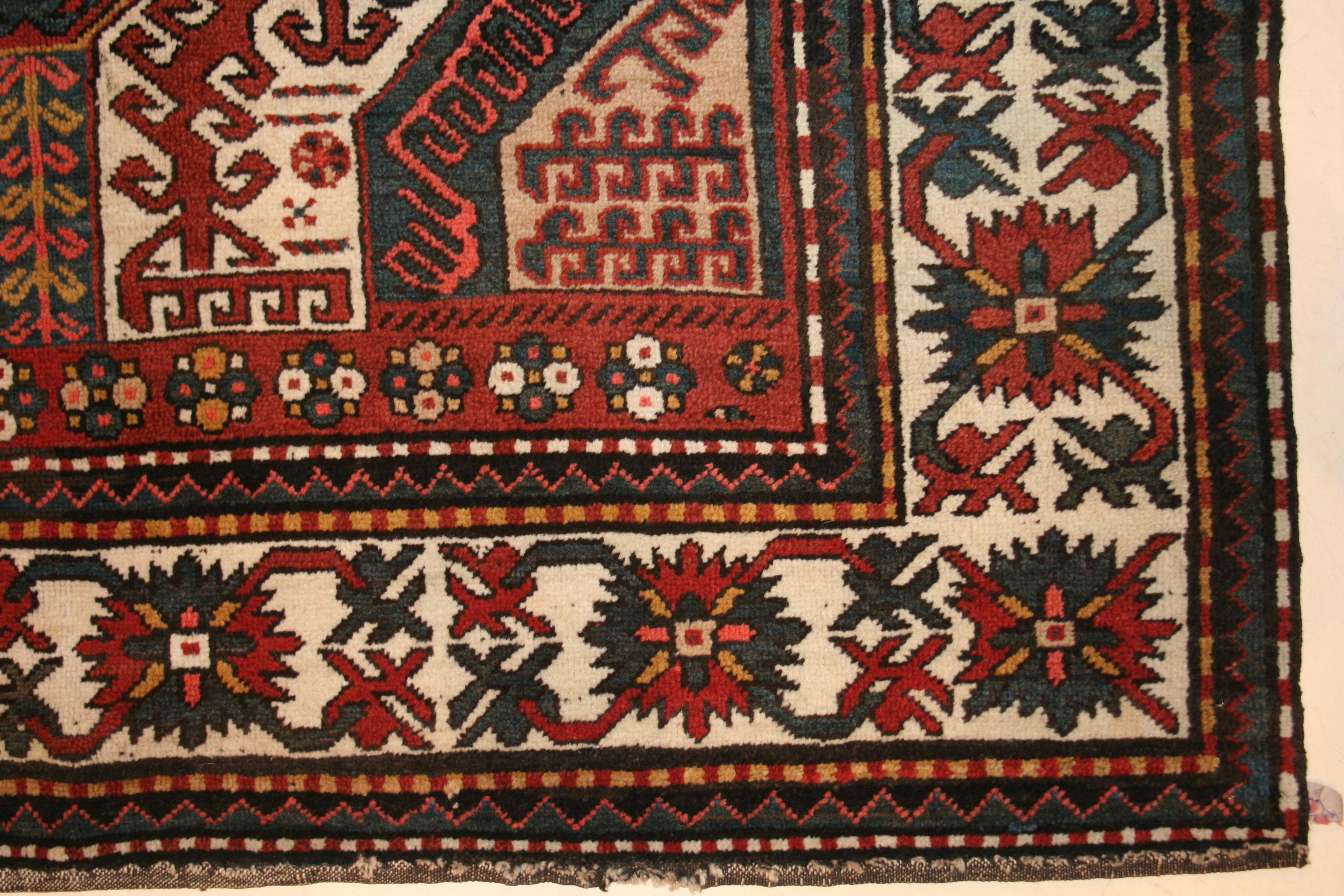 The southern Caucasian rugs of Chelaberd, Chondoresk and Kasim Ushag are all inspired by the early phase of silk Caucasian embroideries. In this finely woven, pristine example, characterized by a brilliant palette, we see a central scorpion-like