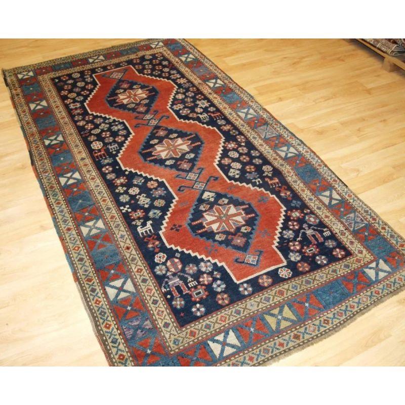 Antique South Caucasian Karabagh or Armenian Kazak rug with triple linked medallion with an X box border.

A superb example of a Karabagh or Armenian Kazak rug. The medallions are surrounded by tribal elements. The rug has a well drawn X box