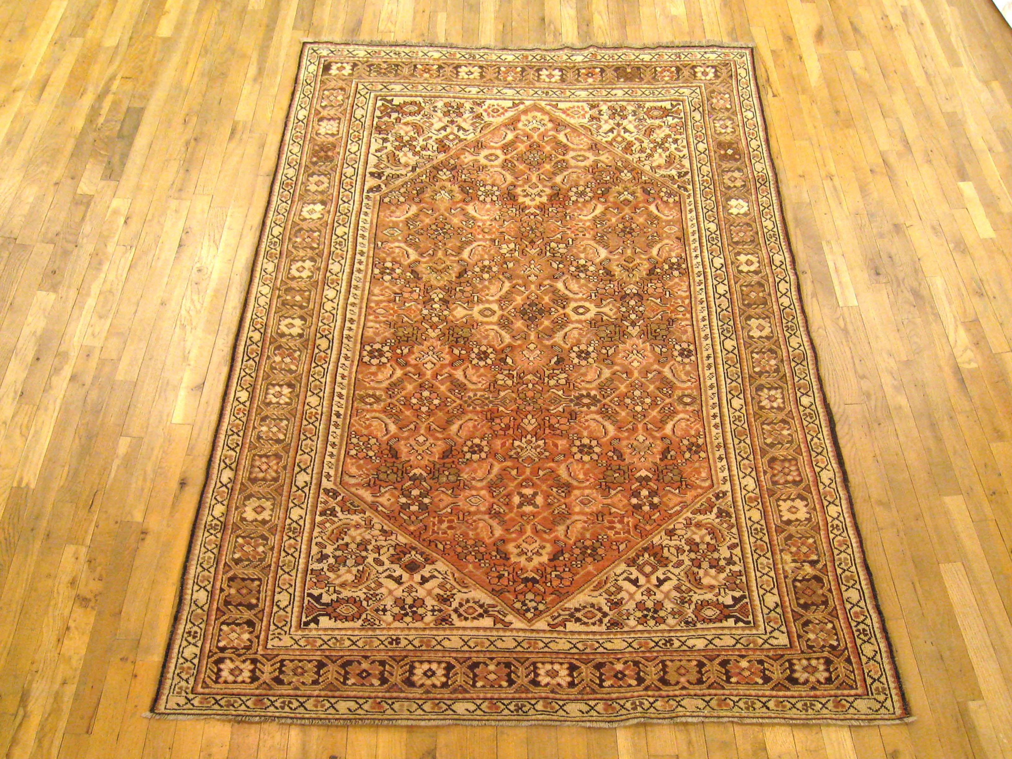 Antique Caucasian Karabagh rug, Room size, circa 1910

A one-of-a-kind antique Caucasian Karabagh Carpet, hand-knotted with soft wool pile. This lovely hand-knotted carpet features an Herati design allover the coral primary field, with a navy
