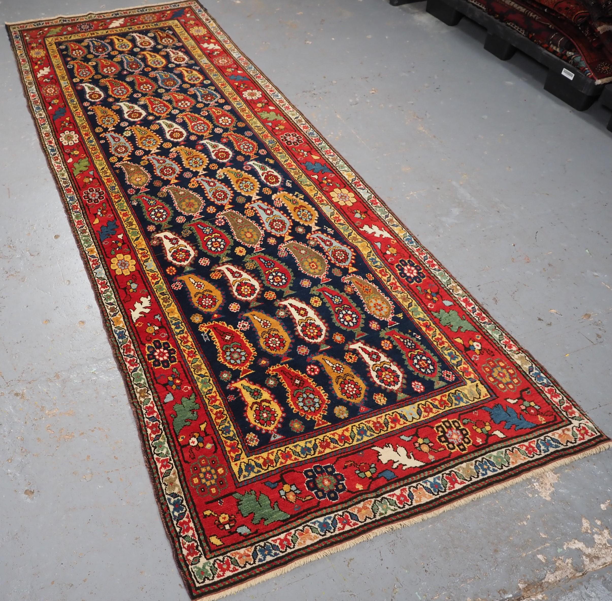 Size: 9ft 7in x 3ft 6in (292 x 106cm).

Antique Caucasian Karabagh region long rug with all over boteh design.

Circa 1900.

A superb example of a Caucasian long rug, with the most amazing colour palette. The large floral boteh stand out against the
