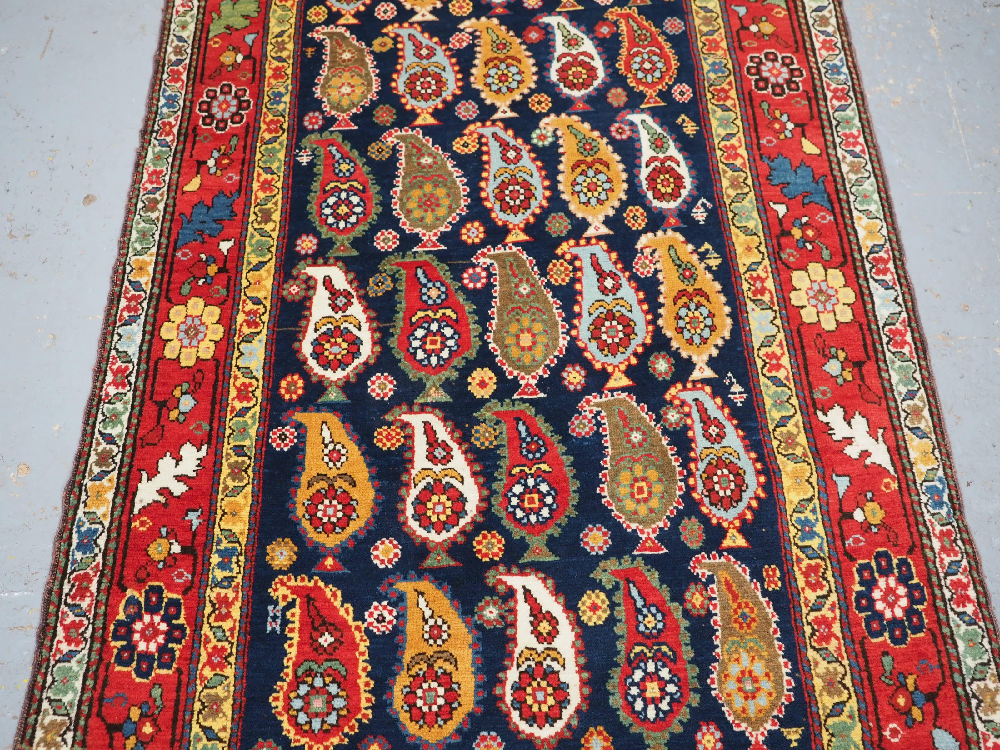 Wool Antique Caucasian Karabagh region long rug with all over boteh design. For Sale