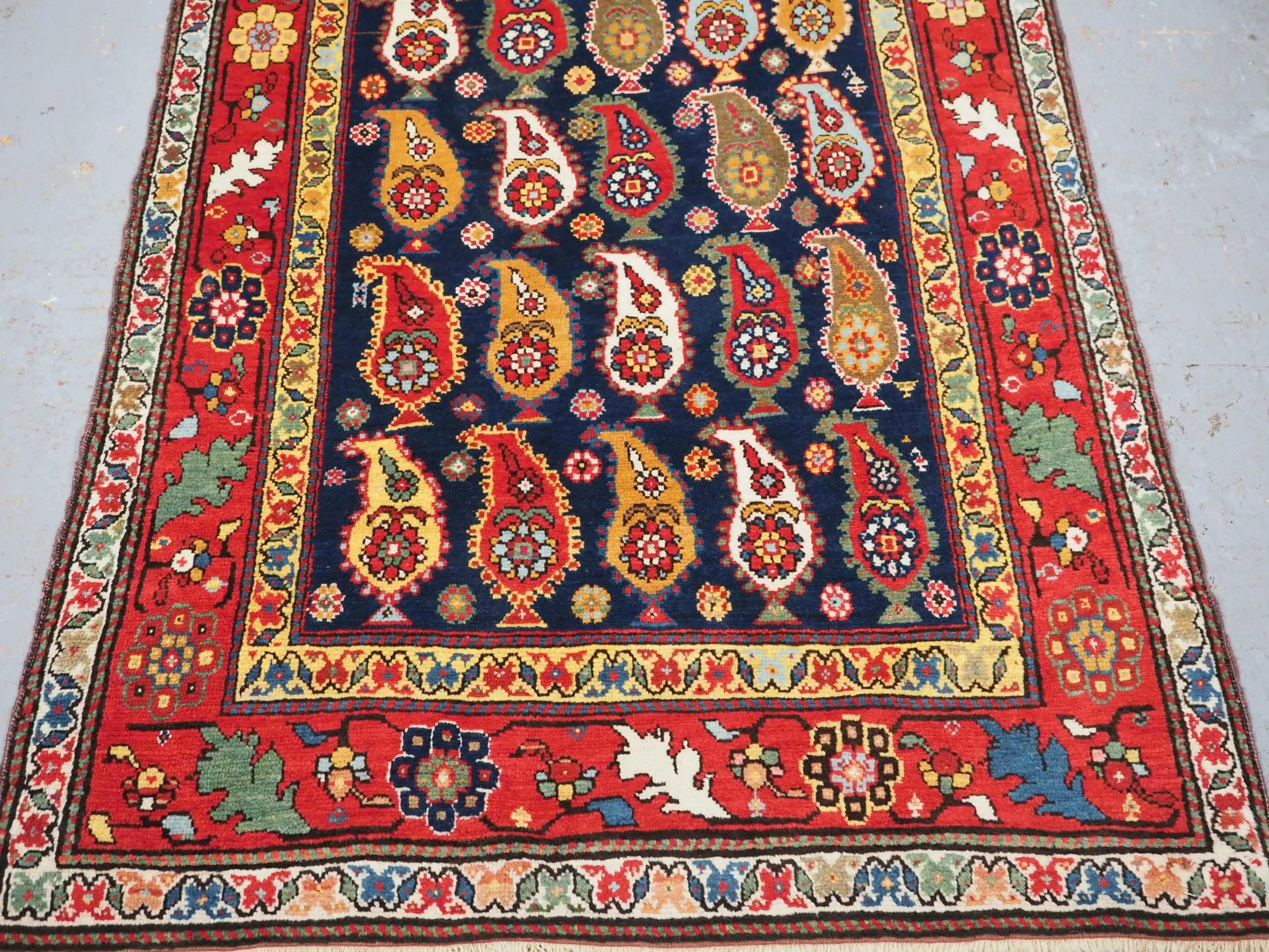 Antique Caucasian Karabagh region long rug with all over boteh design. For Sale 1