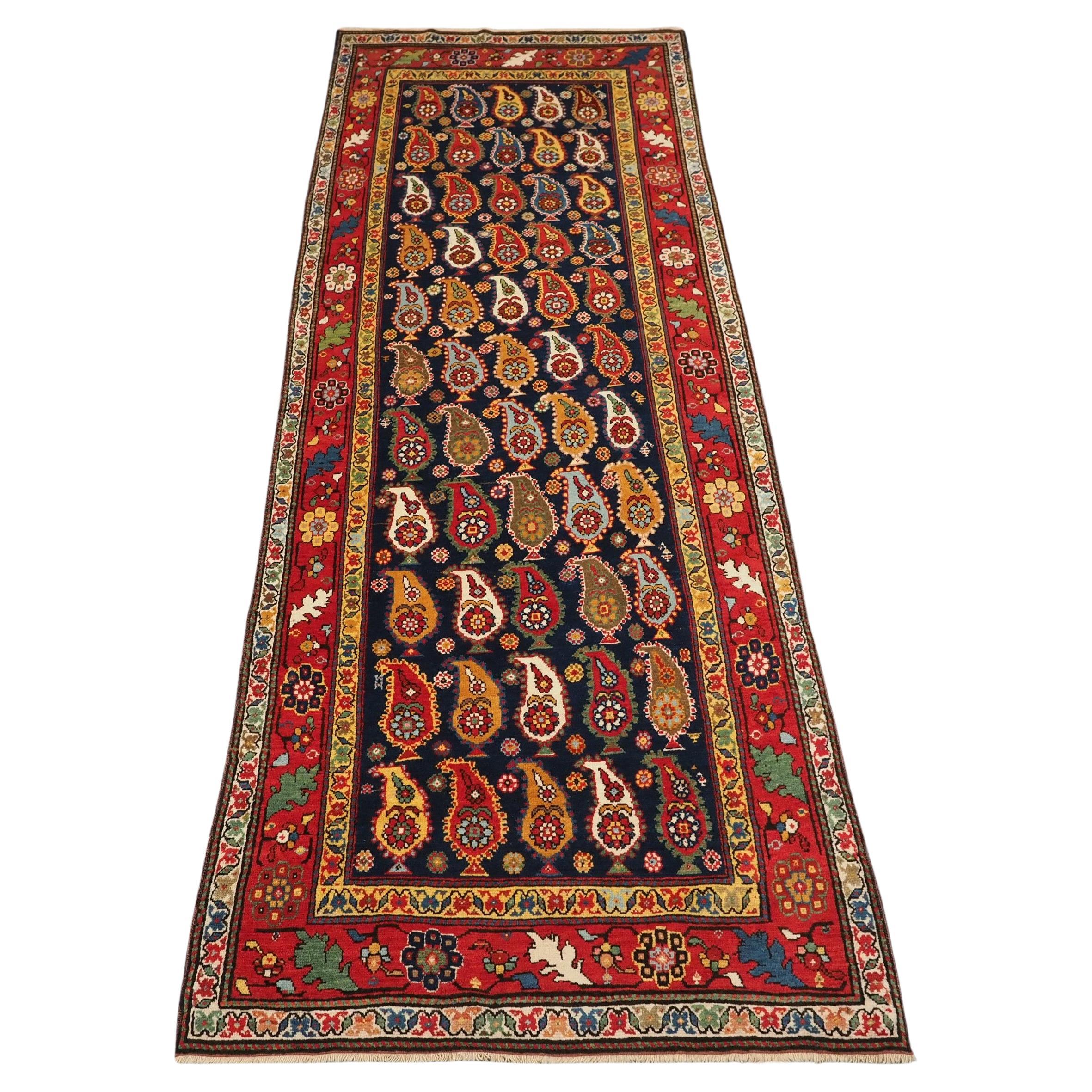 Antique Caucasian Karabagh region long rug with all over boteh design.