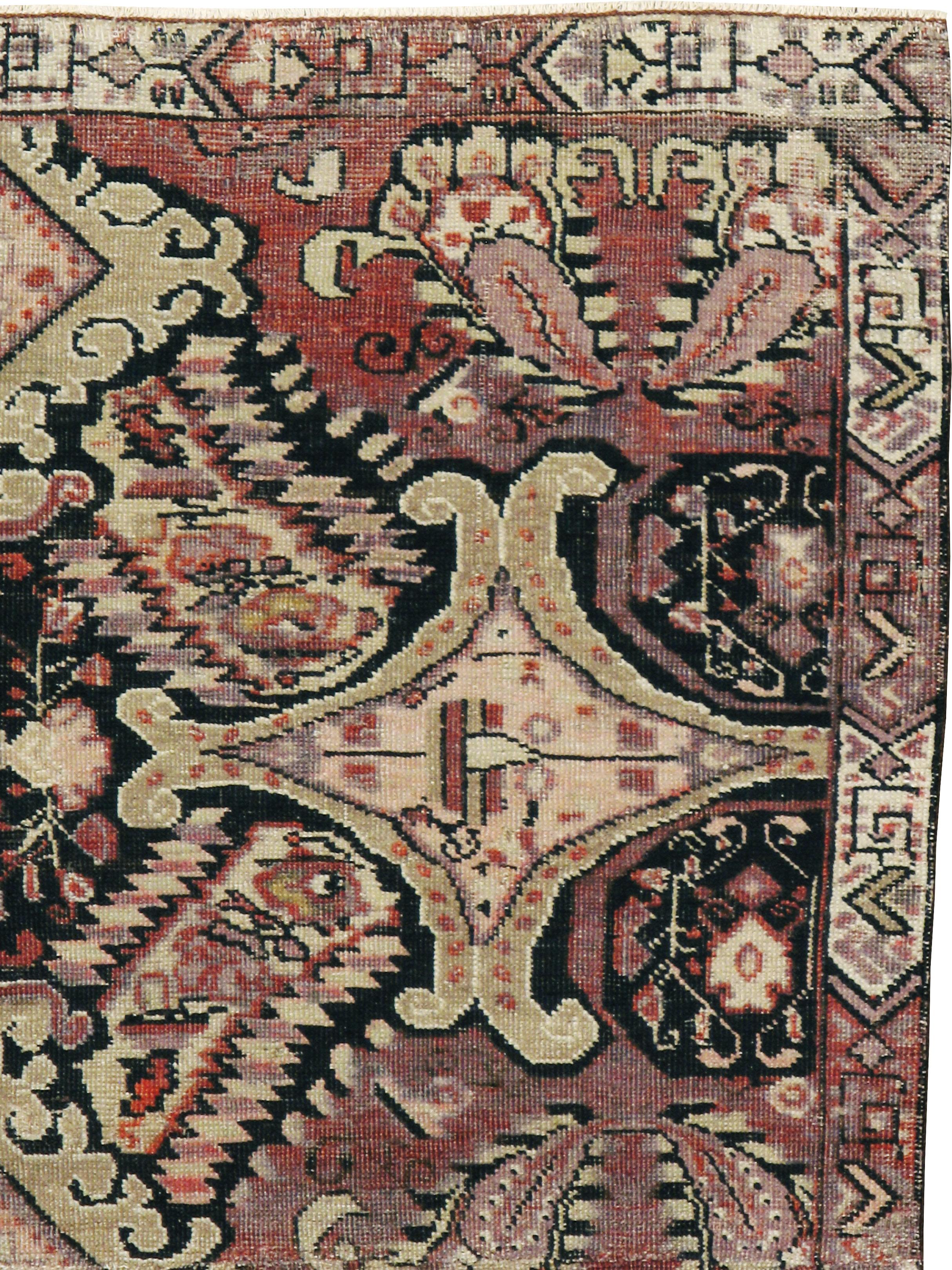 An antique Caucasian Karabagh rug from the early 20th century.
Size: 3'11