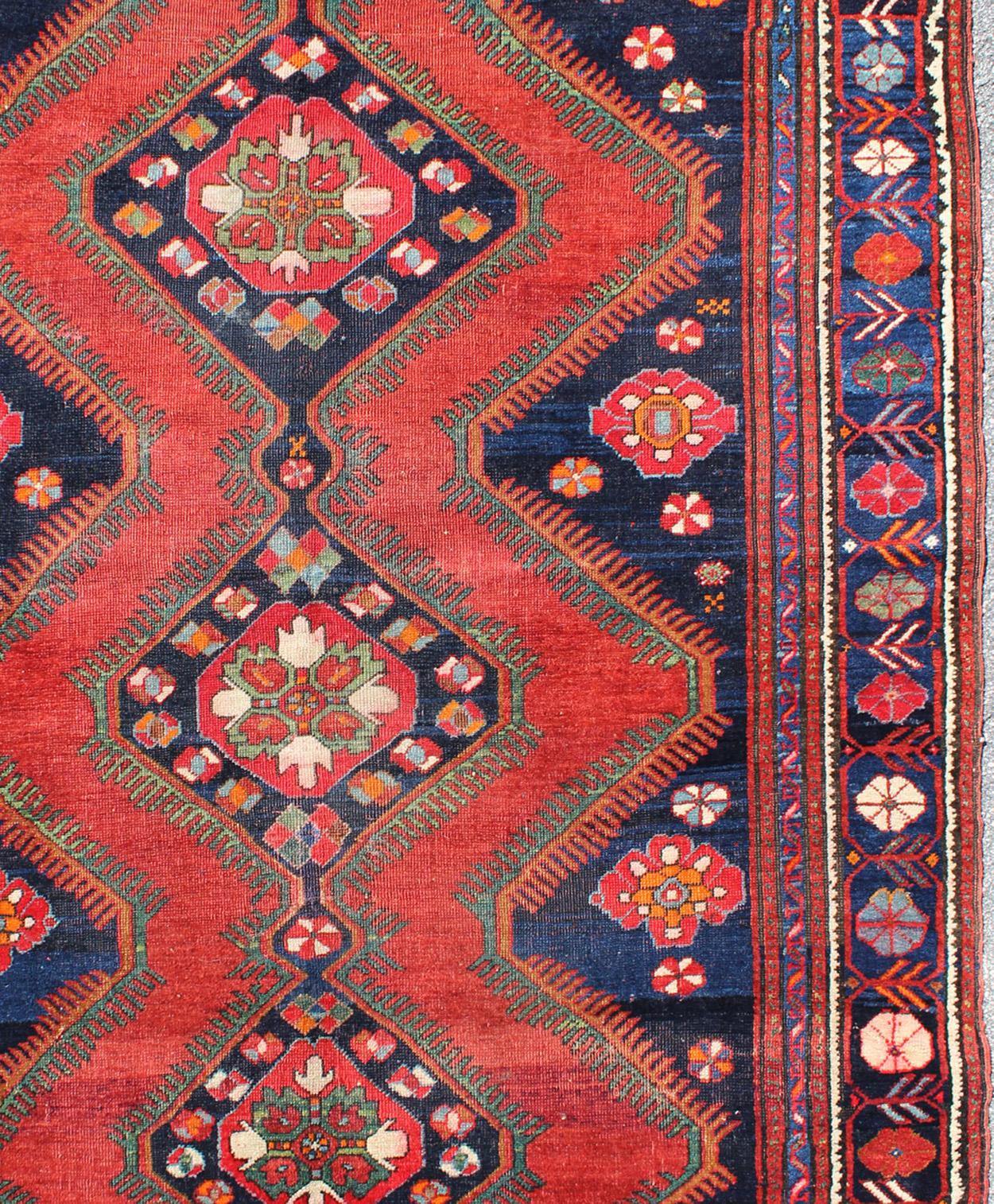 Geometric design antique Caucasian Karabagh tribal rug, rug / B-0501. Caucasian rug.

Measures: 5'6 x 7'5

This antique Kurdish piece features an tribal geometric pattern with three diamond shape medallions. Rich Colors include beautiful tomato