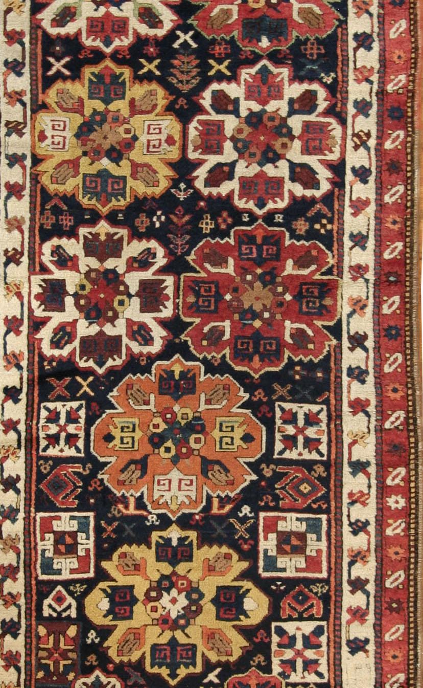 3'9 x 11'5  Across the Aras river from Karaha is the Armenian Caucasian rug area of Karabagh (Black Garden) which wove scatters, runners and gallery rugs from the 17th century onwards, often with cochineal reds and violets as significant tones.