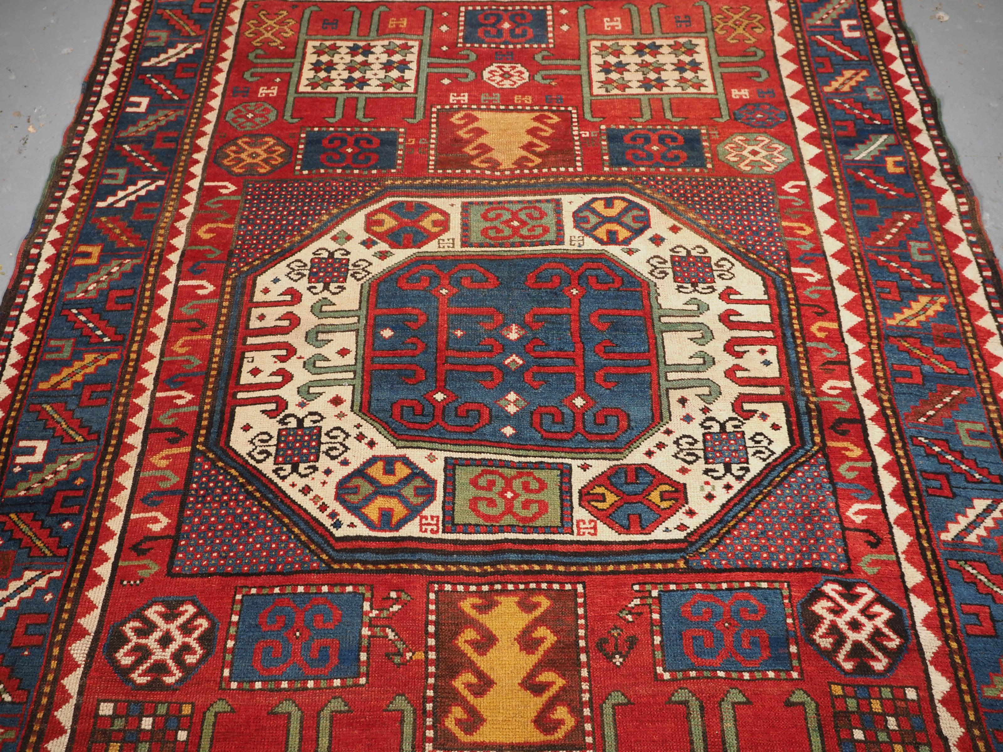 Georgian Antique Caucasian Karachov Kazak Rug of Classic Design on a Red Ground For Sale