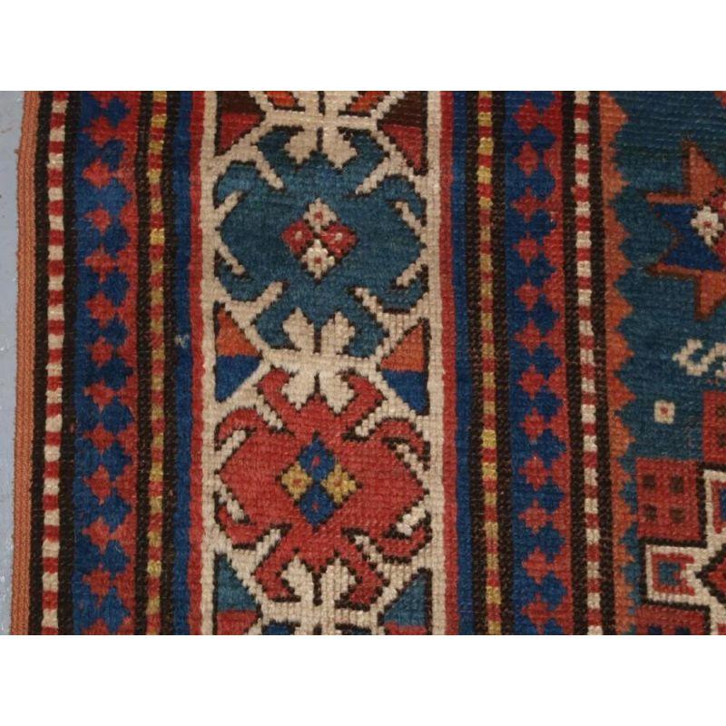 Hand-Woven Antique Caucasian Karachov Kazak Rug on Green Ground For Sale