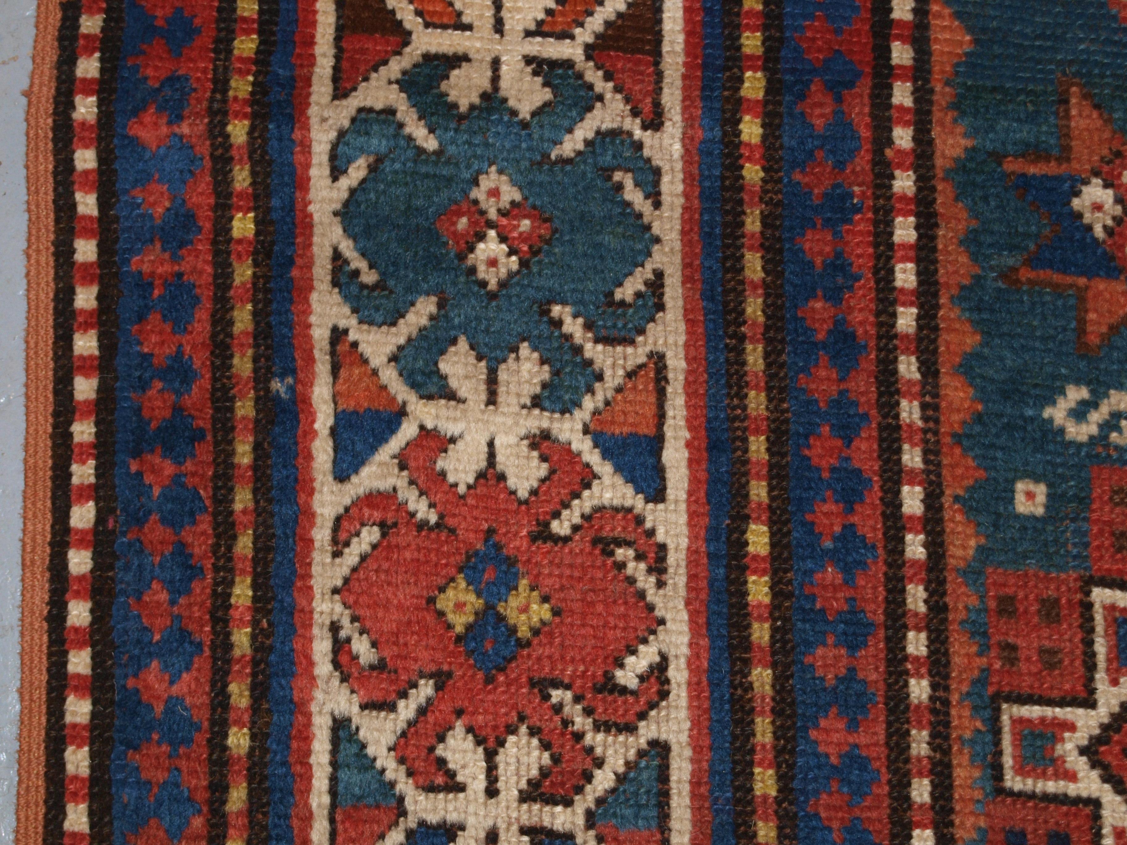 Wool Antique Caucasian Karachov Kazak Rug on Green Ground For Sale