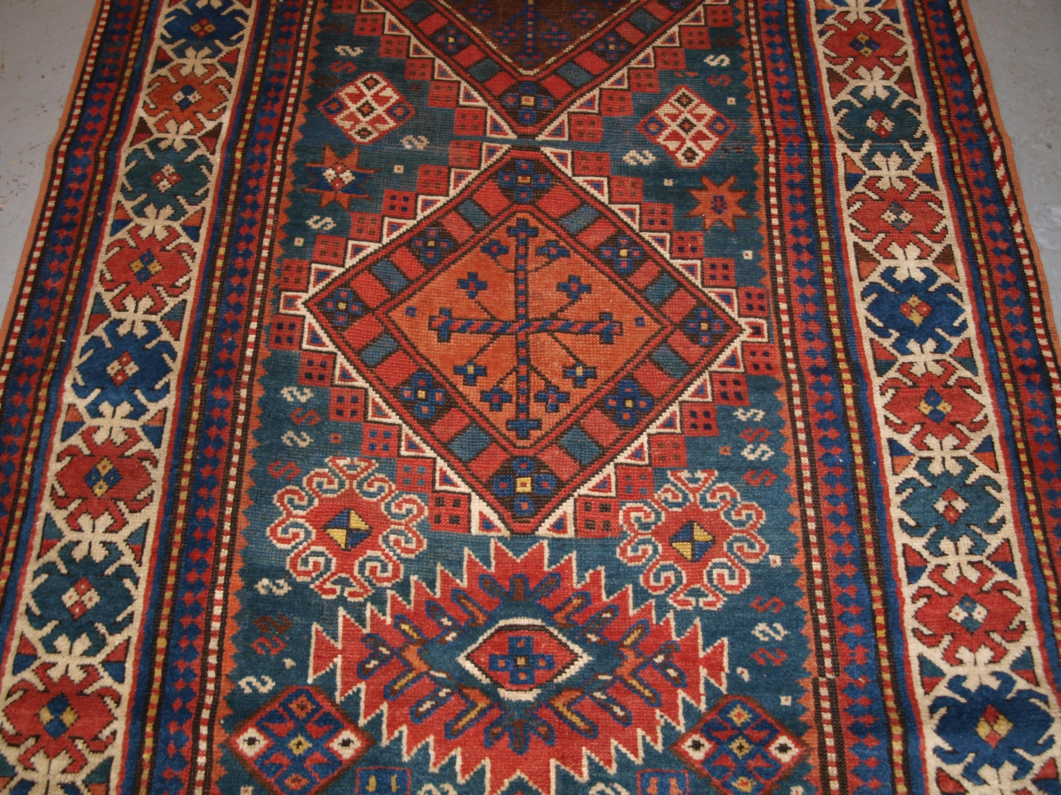 Wool Antique Caucasian Karachov Kazak Rug on Green Ground For Sale