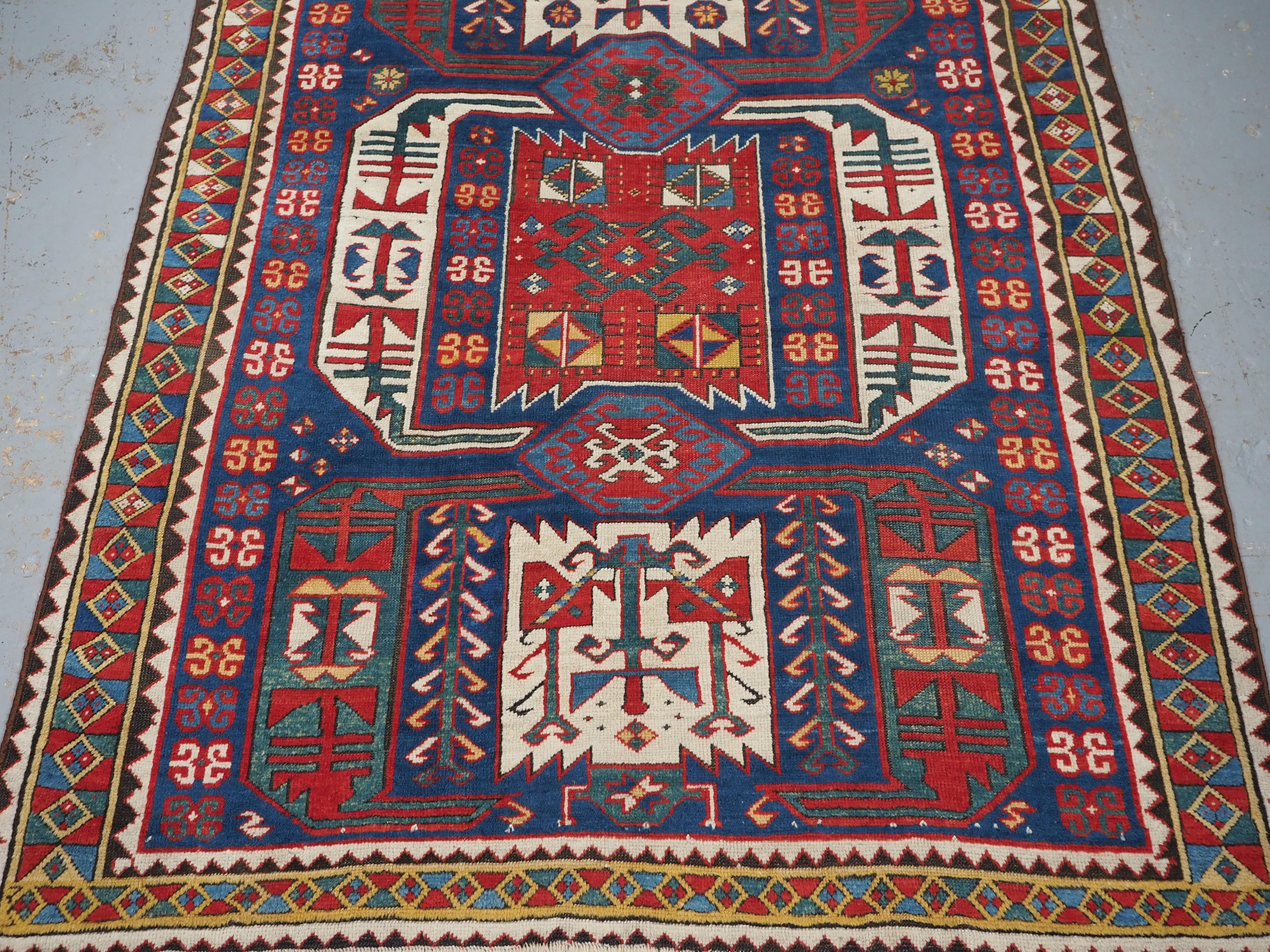Wool Antique Caucasian Kasim-Usag rug of classic design with superb colour., 1856. For Sale