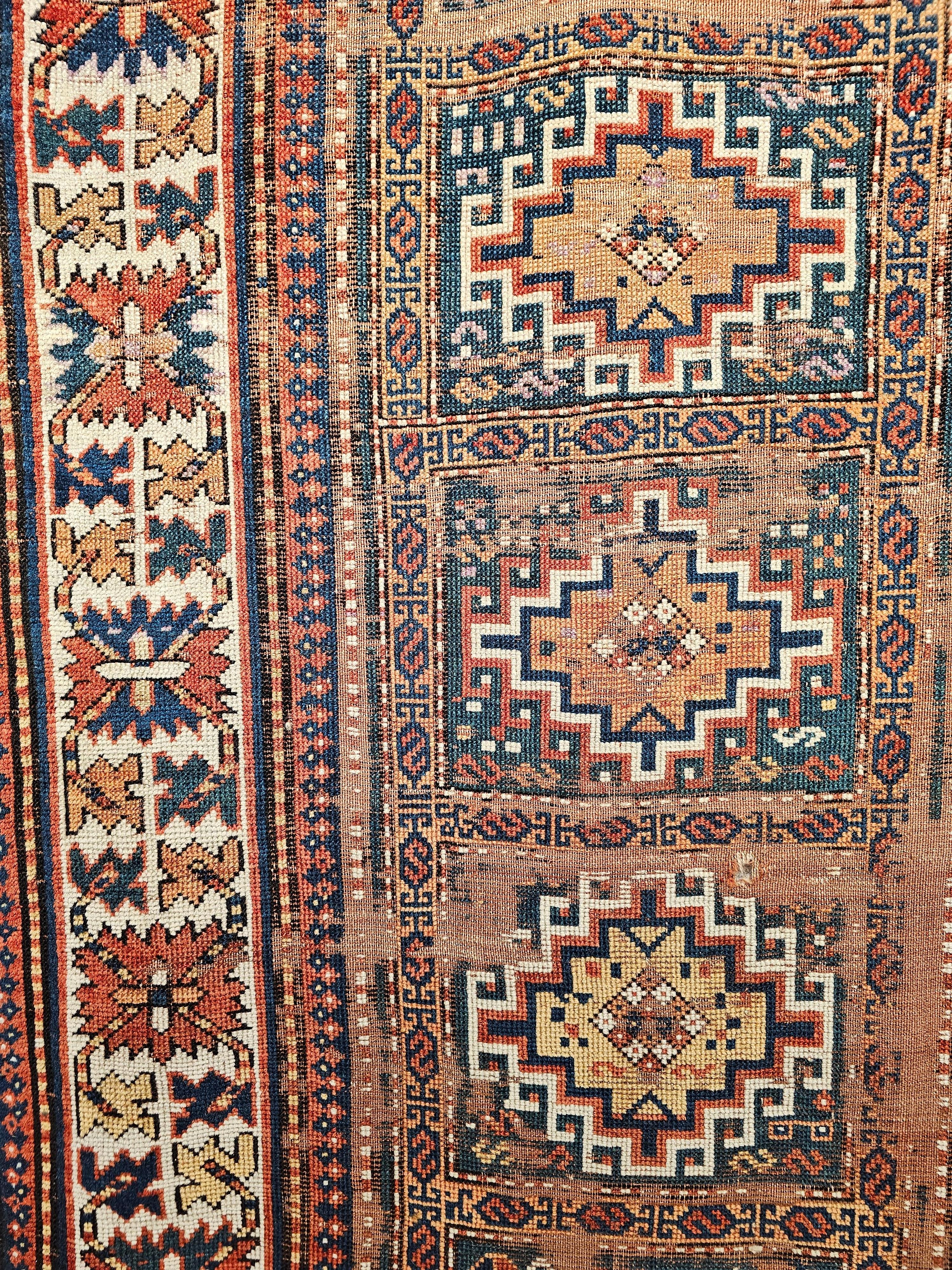 Wool 19th Century Caucasian Kazak Area Rug in Geometric Pattern in Blue, Ivory, Red For Sale