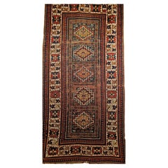 Antique 19th Century Caucasian Kazak Area Rug in Geometric Pattern in Blue, Ivory, Red