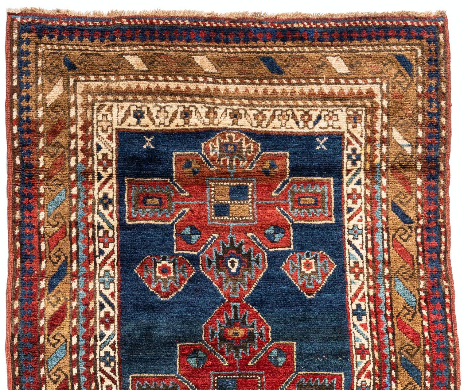 This lovely antique Caucasian Kazak carpet measures 4 x 8.9 ft and is from the 1930s. 

 
