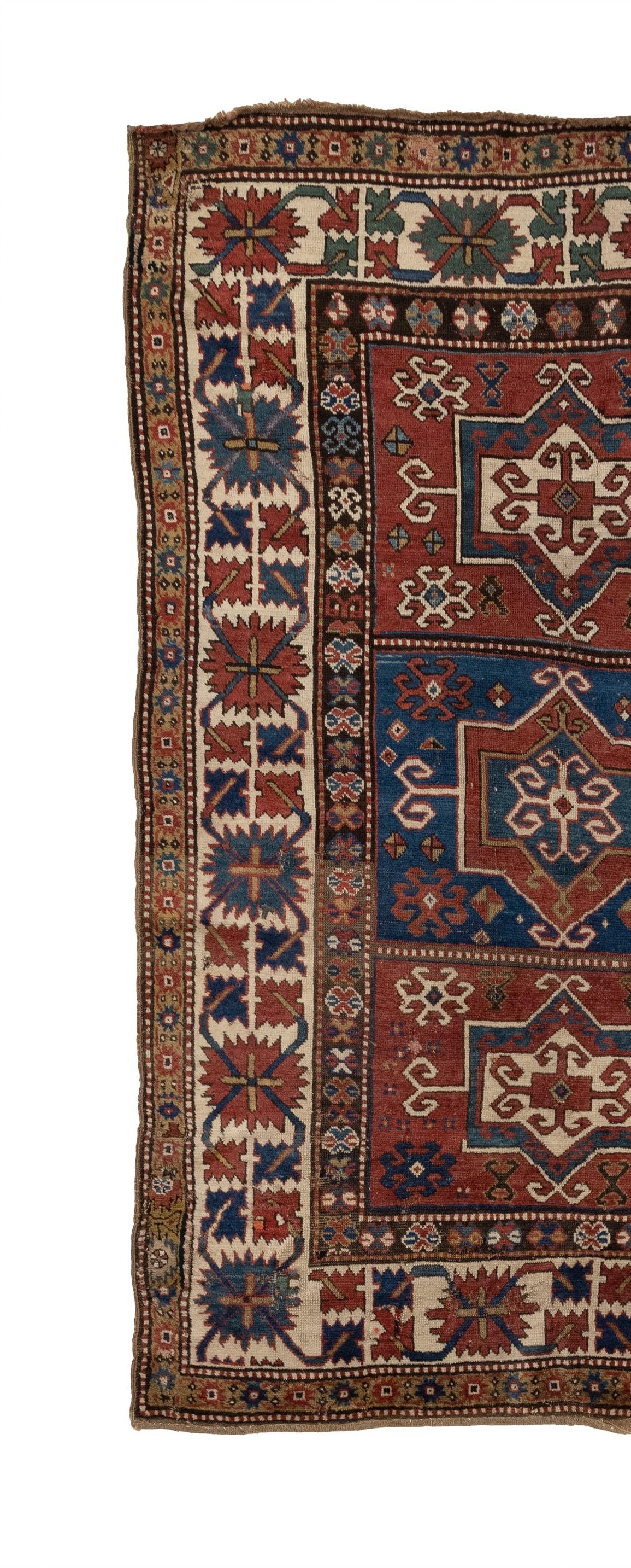 This is an Antique Caucasian Kazak from the 1880s featuring three medallions. Its intricate details are stunning, and it boasts a variety of geometric patterns in color schemes that range from earthy to vibrant. The Tribal Collection is perfect for