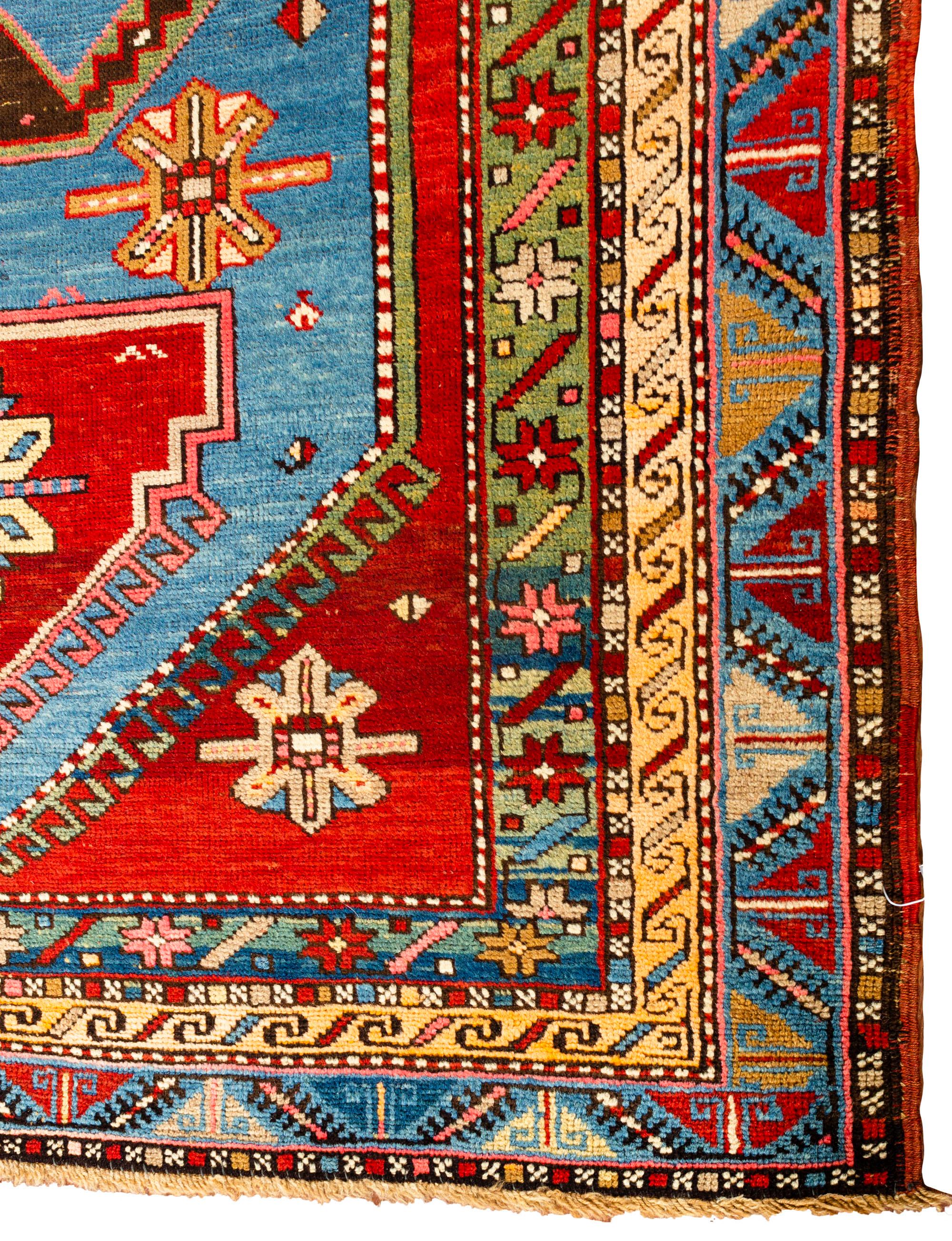 A south west Caucasian Kazak handwoven rug circa 1880, with bold and vibrant colors, that create a true sense of beauty, to this tribal rug. The Caucasus Mountains, between Persia and Russia are justly famous for their colorful, geometric antique