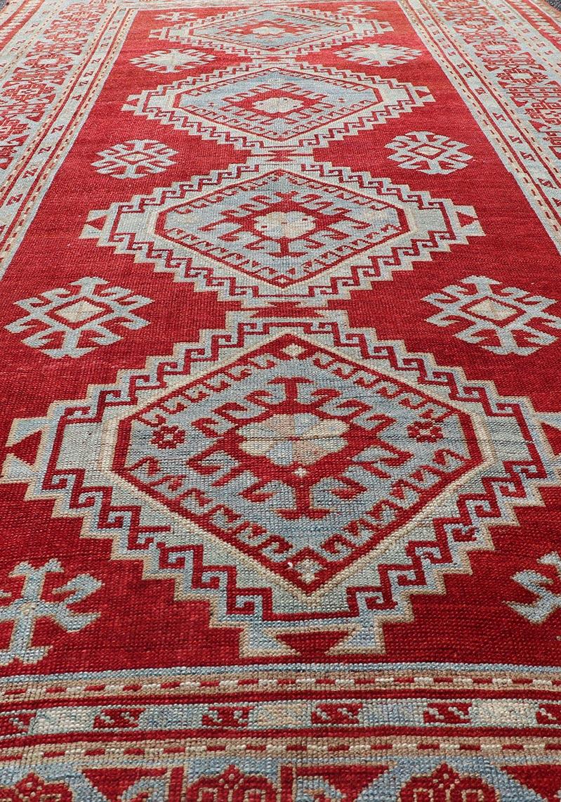Wool Antique Caucasian Kazak Gallery Rug in Brilliant Red with Geometric Design For Sale