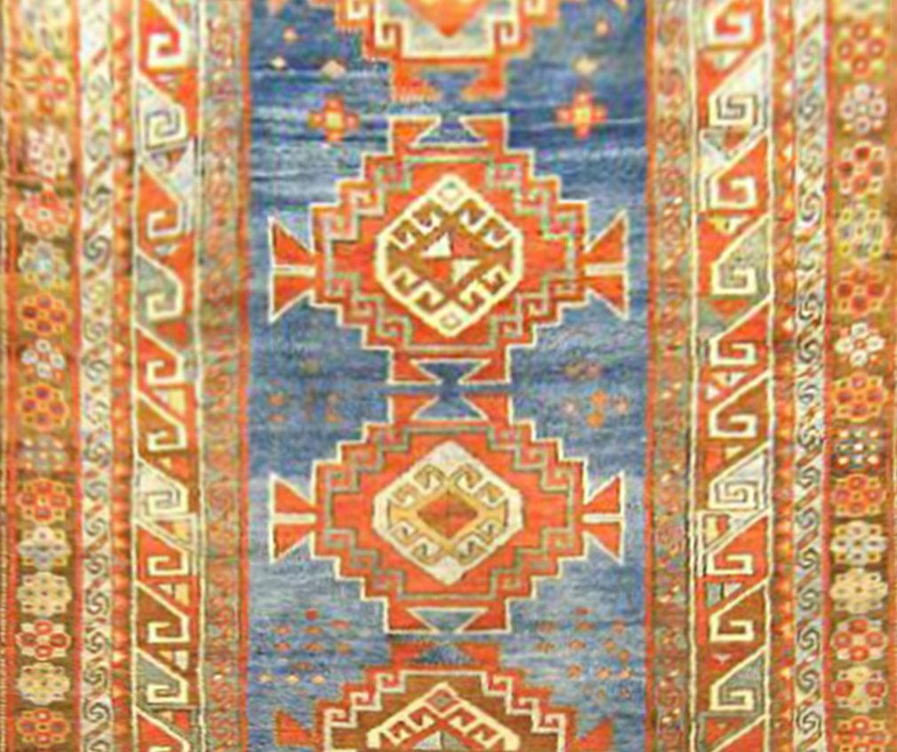 Hand-Knotted Antique Caucasian Kazak Oriental Rug in Runner Size with Multiple Medallions For Sale