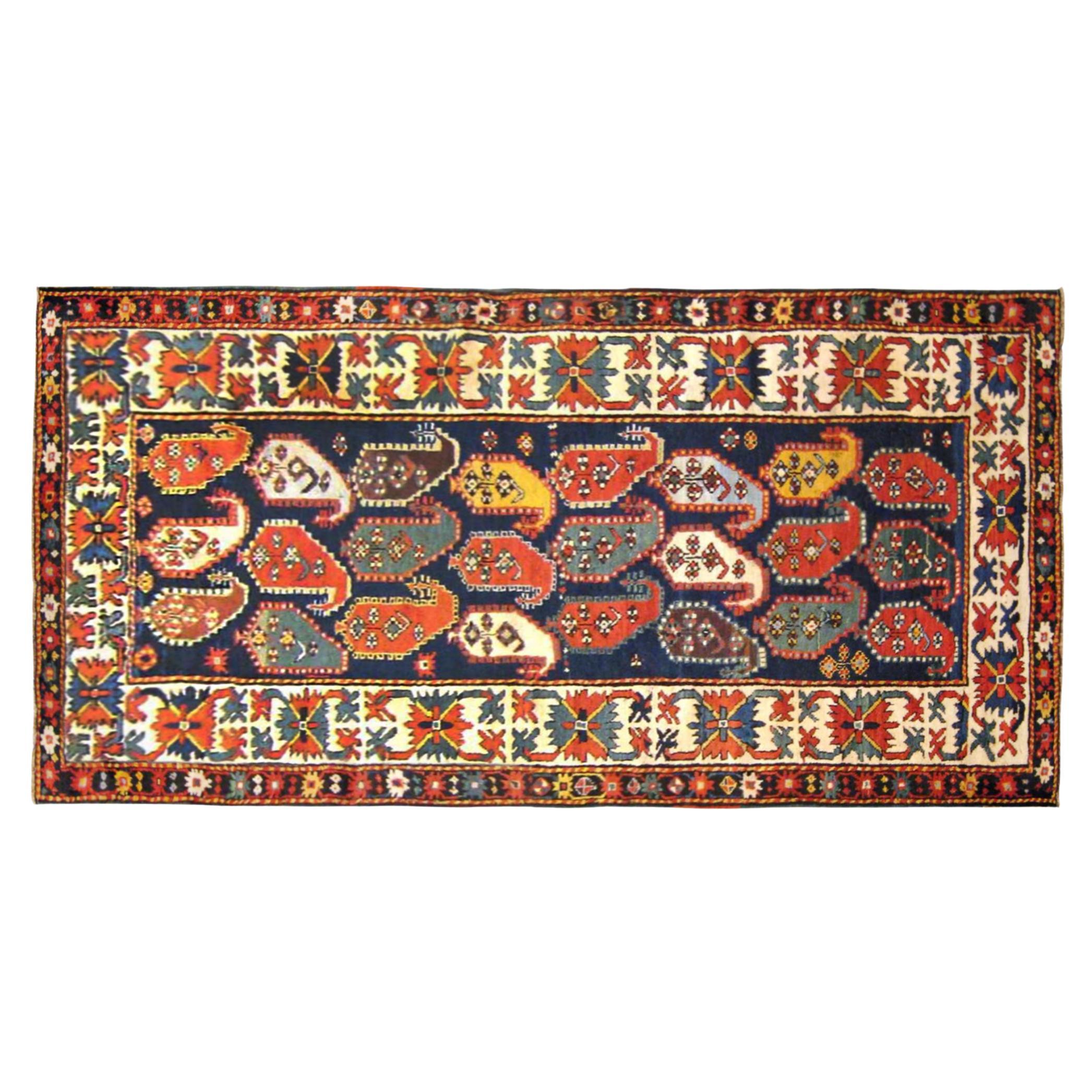Antique Caucasian Kazak Oriental Rug in Runner Size with Paisley Design For Sale