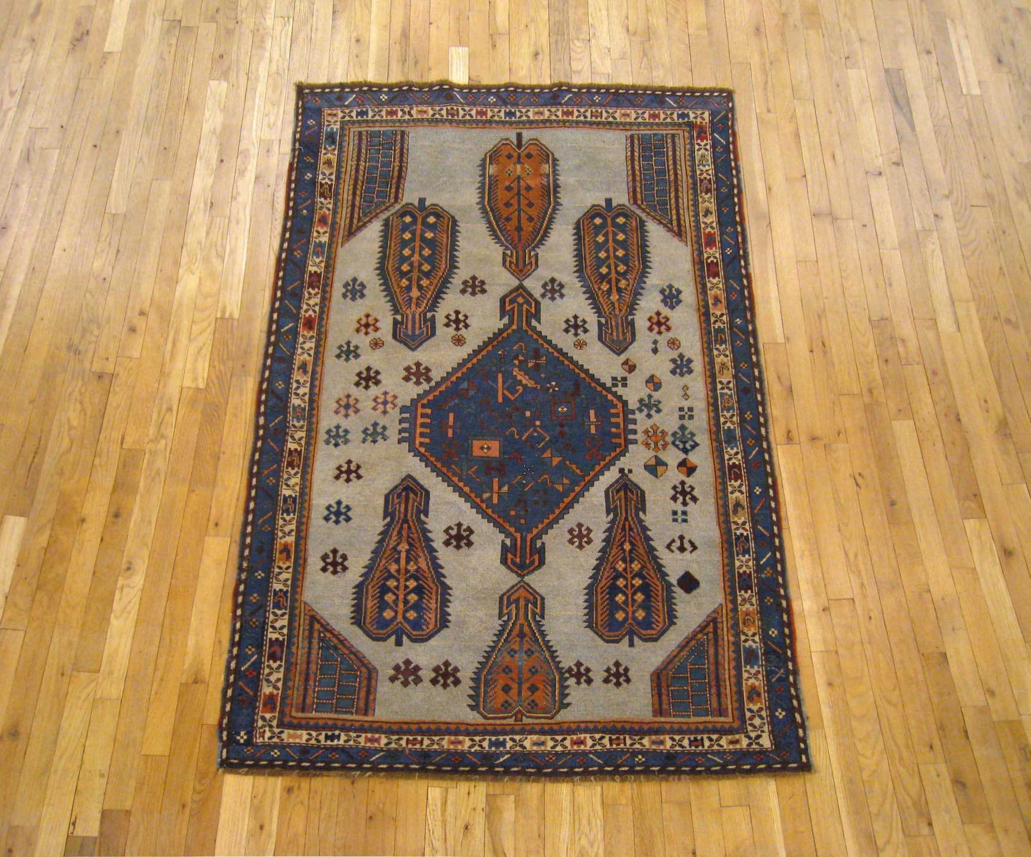 Antique Caucasian Kazak oriental carpet, small size, circa 1900

A one-of-a-kind antique Caucasian Kazak Oriental Carpet, hand-knotted with soft wool pile. This lovely hand-knotted wool rug features a central medallion with corner design on the