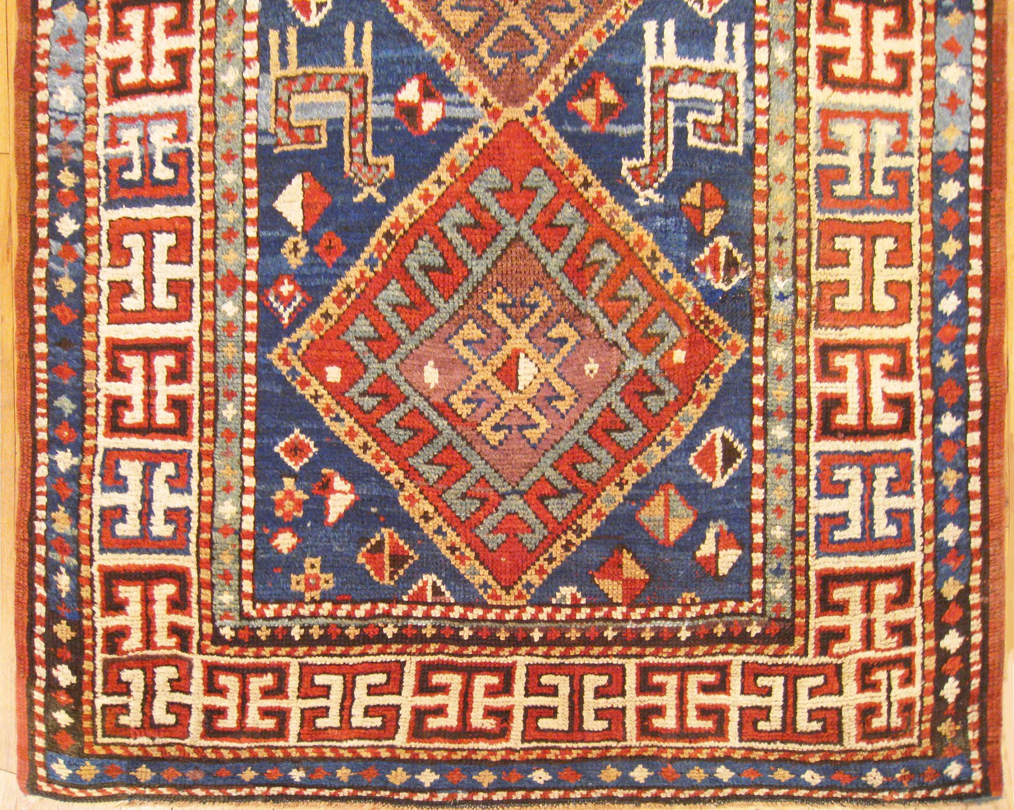 Hand-Knotted Antique Caucasian Kazak Oriental Rug in Small Size with Multiple Medallions For Sale