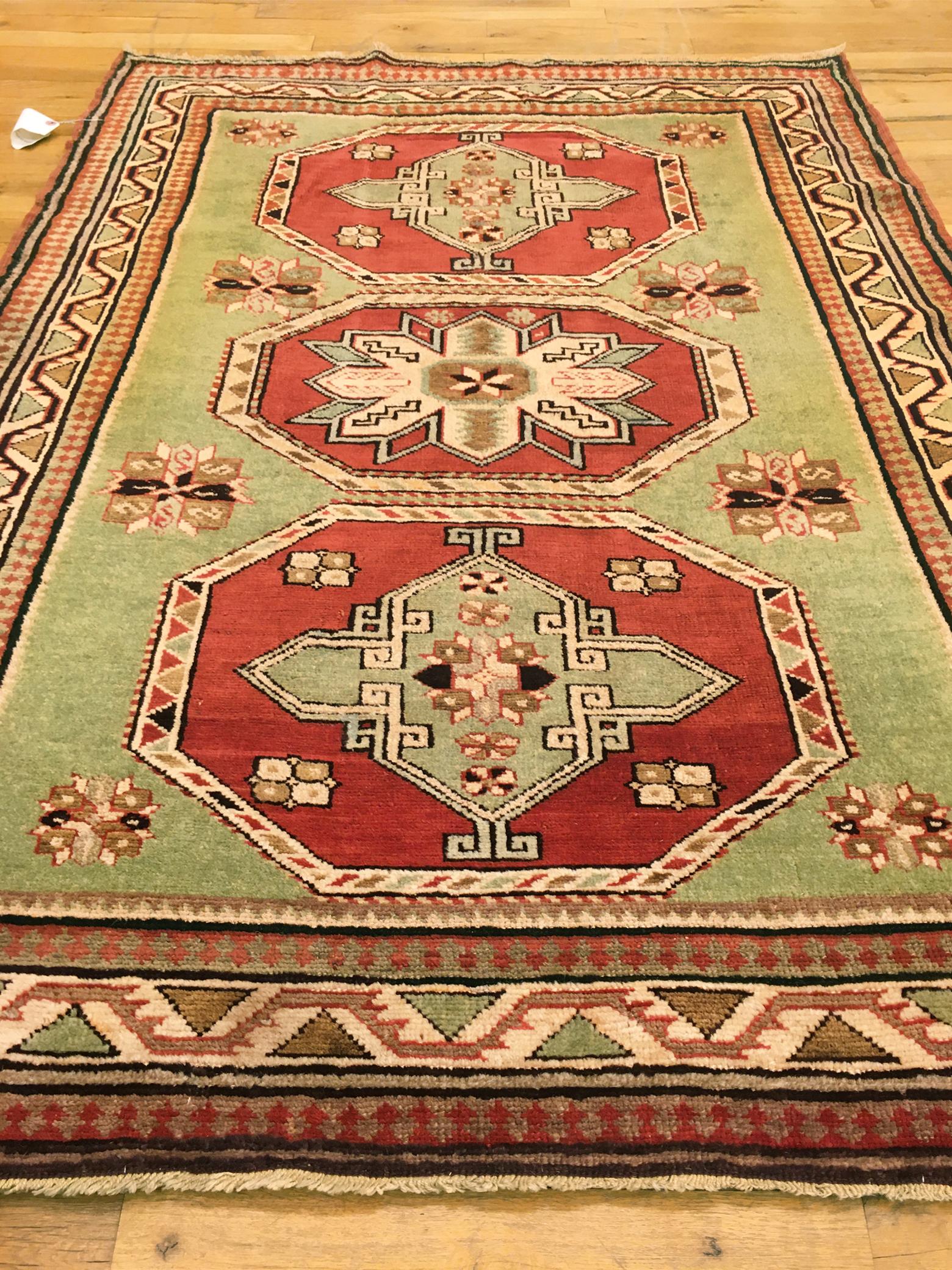 Wool Antique Caucasian Kazak Oriental Rug, in Small Squarish Size w/ Green Background For Sale