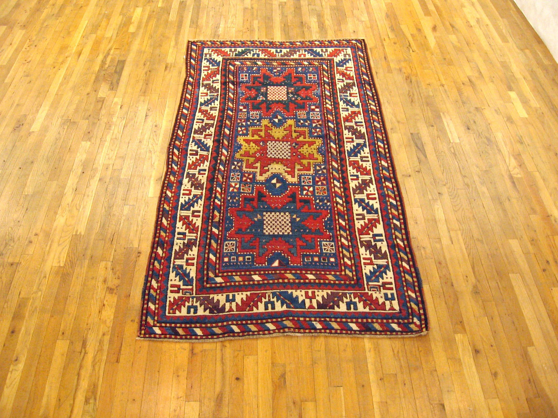Antique Caucasian Kazak Oriental Rug, in Small Size, with Starburst Design

A one-of-a-kind antique Caucasian Kazak oriental rug, hand-knotted with soft wool pile on a cotton foundation. 

This beautiful carpet features a 