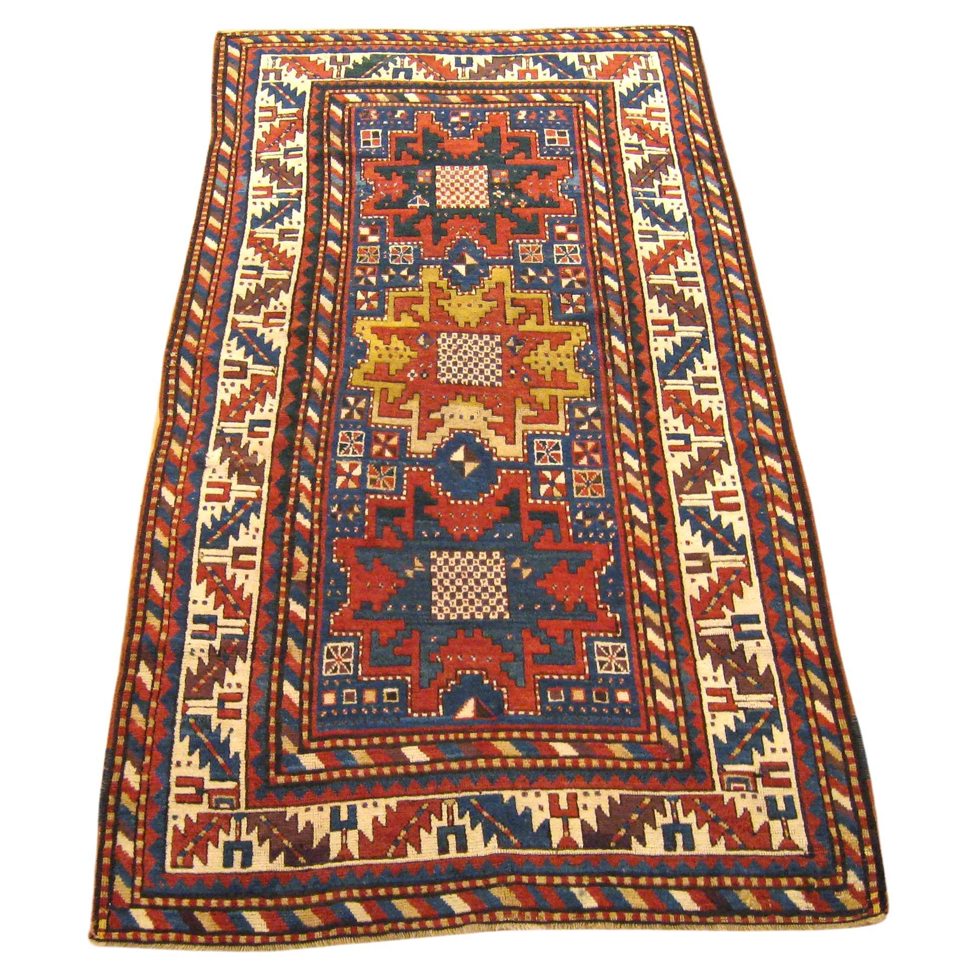 Antique Caucasian Kazak Oriental Rug, Small Size, Starburst Design & Blue Field For Sale