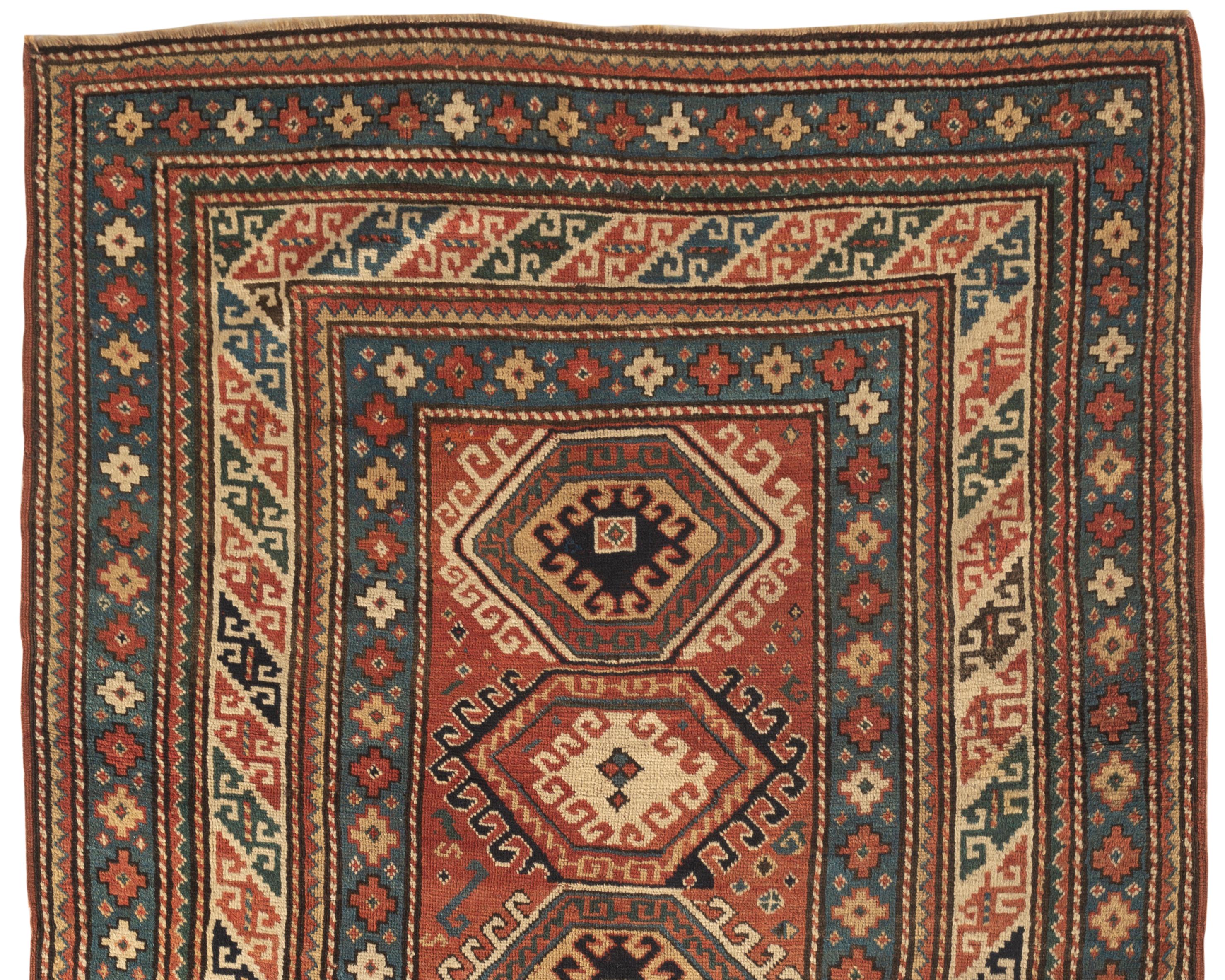 Antique Caucasian Kazak rug, circa 1880. A south west Caucasian Kazak handwoven rug circa 1880 with a truly amazing and intricate design from the central field almost exploding outward with the multiple borders to create a magnificent small piece of