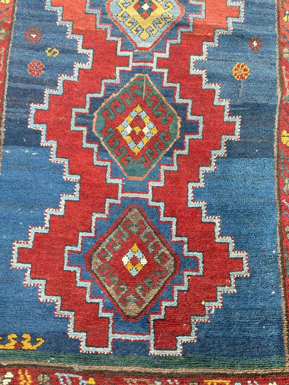 Nice late 19th century Kazak rug with beautiful geometrical design and natural colors with blue, red, yellow and green, entirely hand knotted with wool velvet on wool foundation.