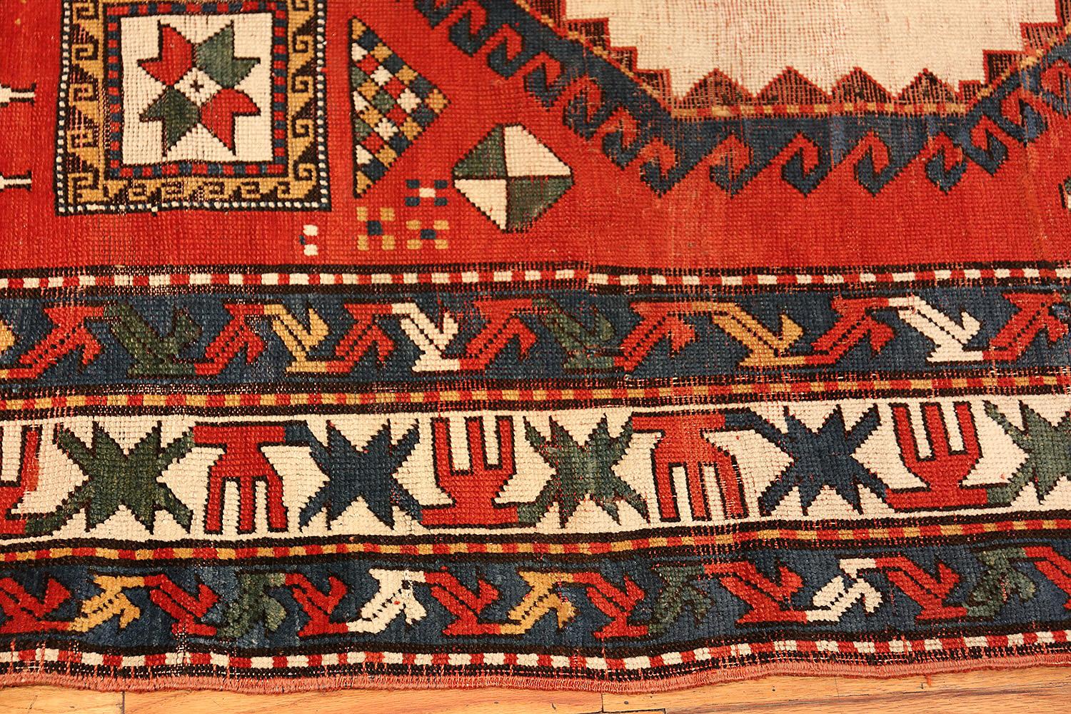 Gorgeous Tribal antique Caucasian Kazak rug, country of origin / rug type: Caucasian rugs, circa 1900. Size: 6 ft 7 in x 9 ft 2 in (2.01 m x 2.79 m)

 Kazak rugs are both rustic and irresistible. This brightly colored piece features tribal symbols