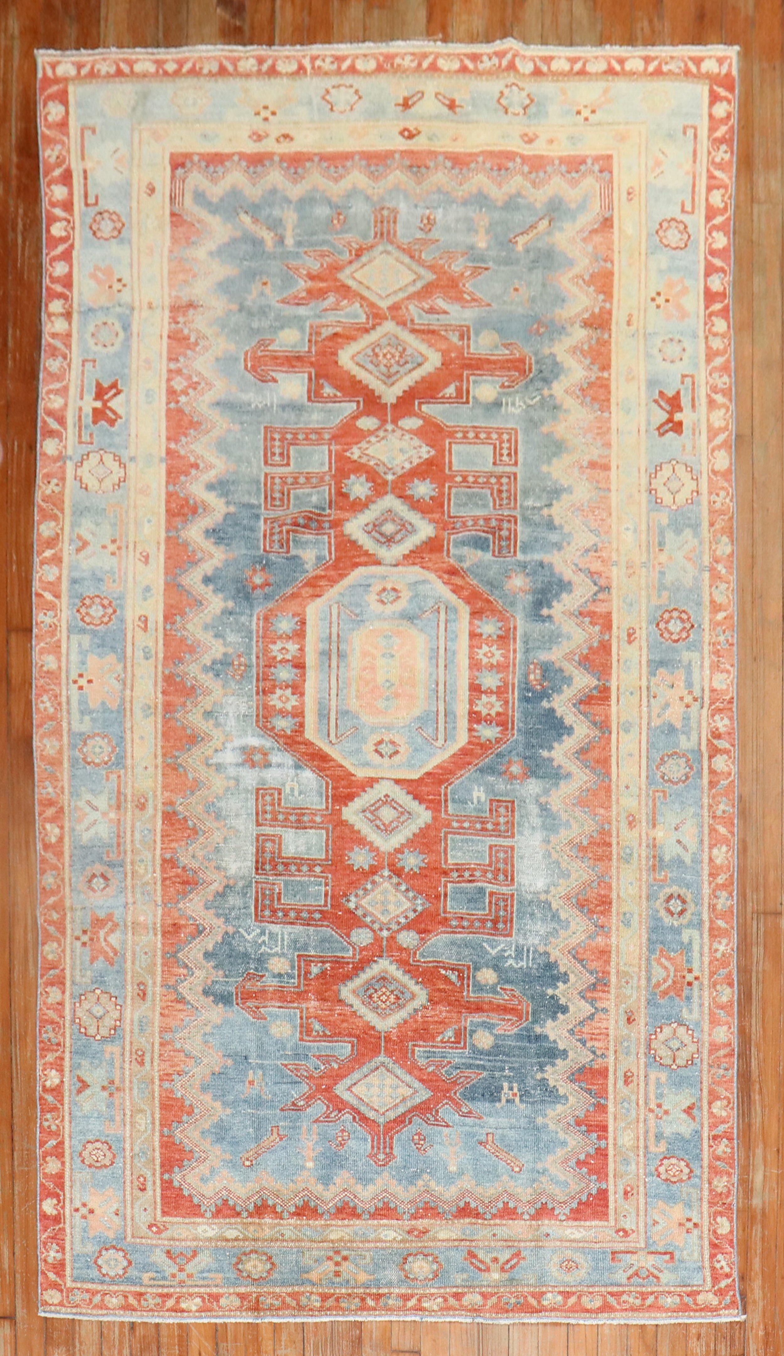 an early 20th Century Caucasian Kazak rug in faded blues and reds

4'6'' x 7'9''

