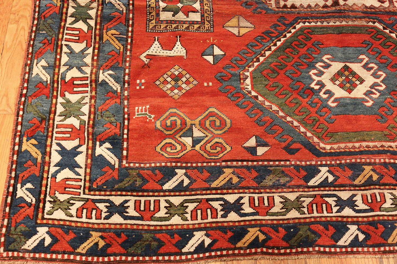 Tribal Antique Caucasian Kazak Rug. Size: 6 ft 7 in x 9 ft 2 in In Fair Condition In New York, NY