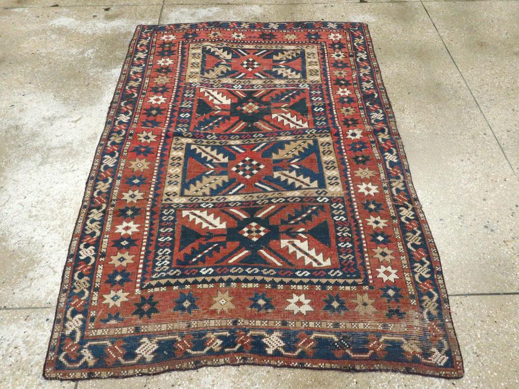 Distressed Caucasian Rug With A Tribal Design In Rust, Dark Blue, And Cream In Distressed Condition For Sale In New York, NY