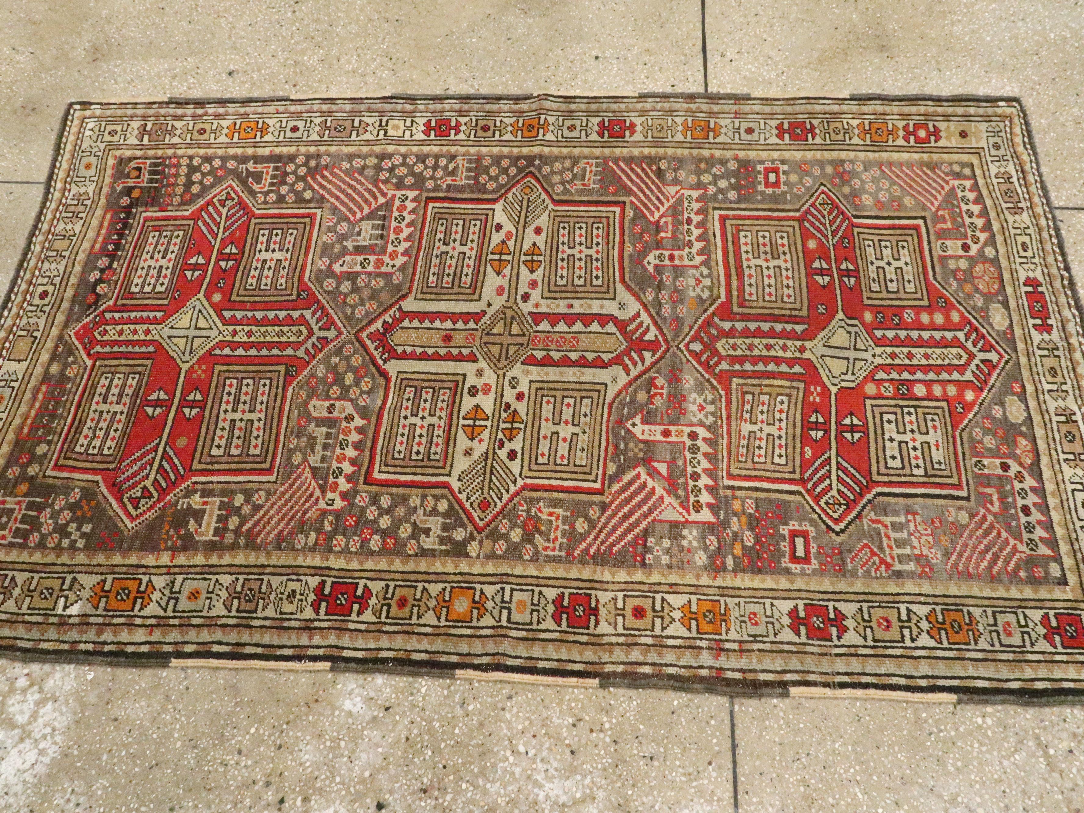 Small Handmade Caucasian Tribal Rug In Shades of Grey-Brown and Red 1