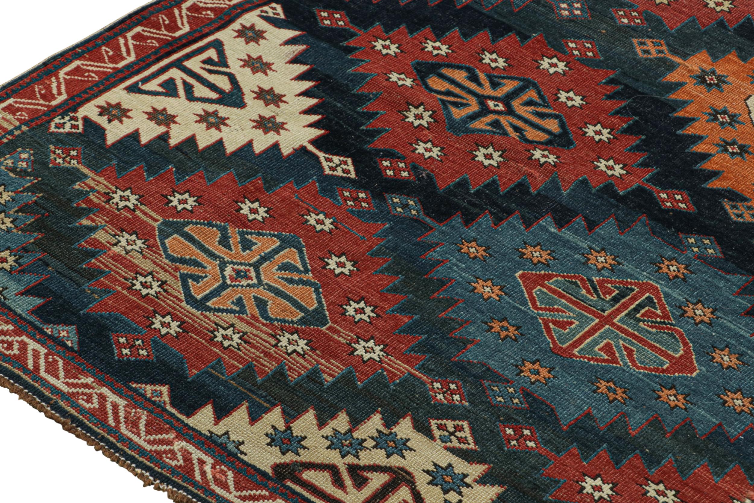 Early 20th Century Antique Caucasian Kazak Rug in Red & Blue Tribal Patterns from Rug & Kilim For Sale