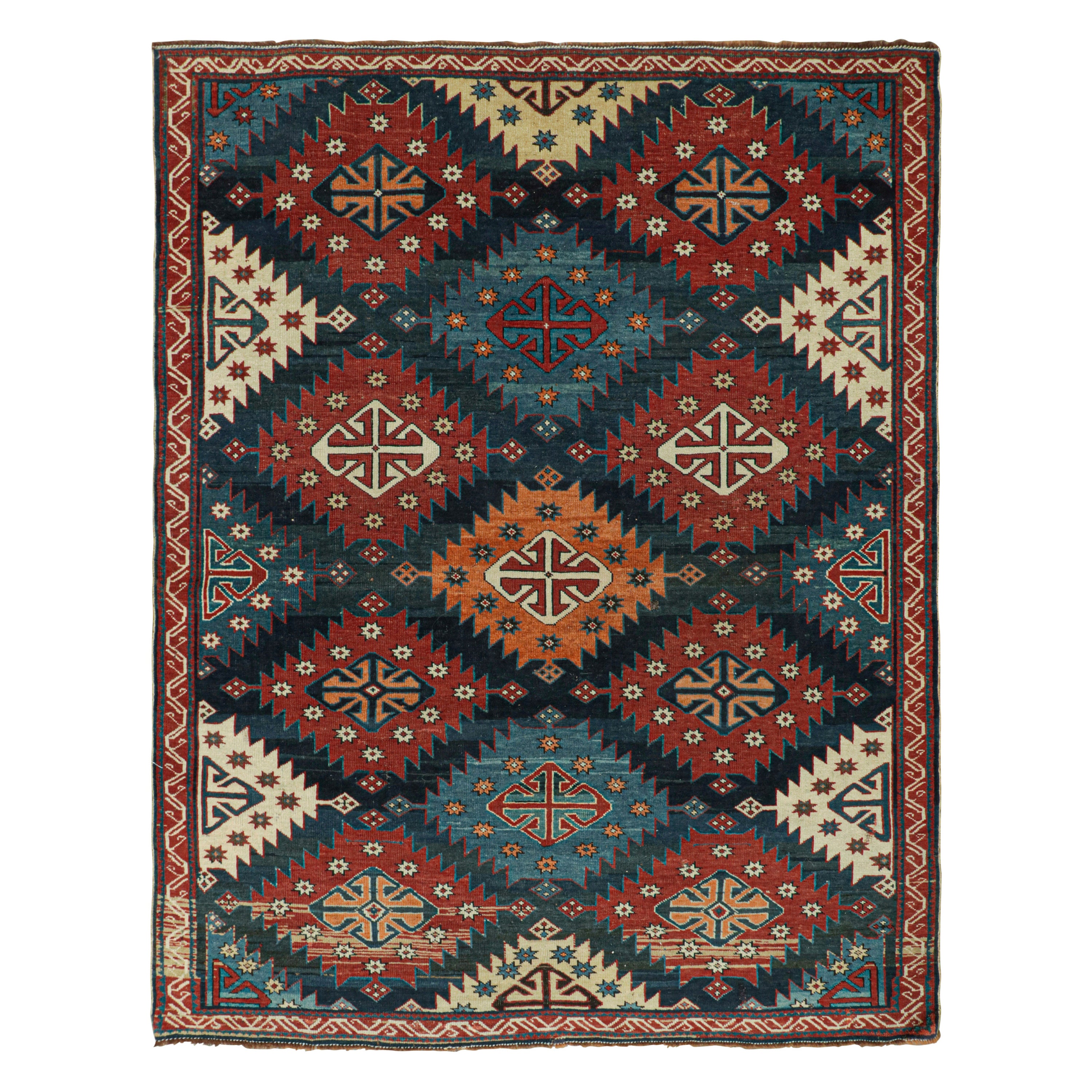 Antico tappeto kazako caucasico con motivi tribali rossi e blu da Rug & Kilim