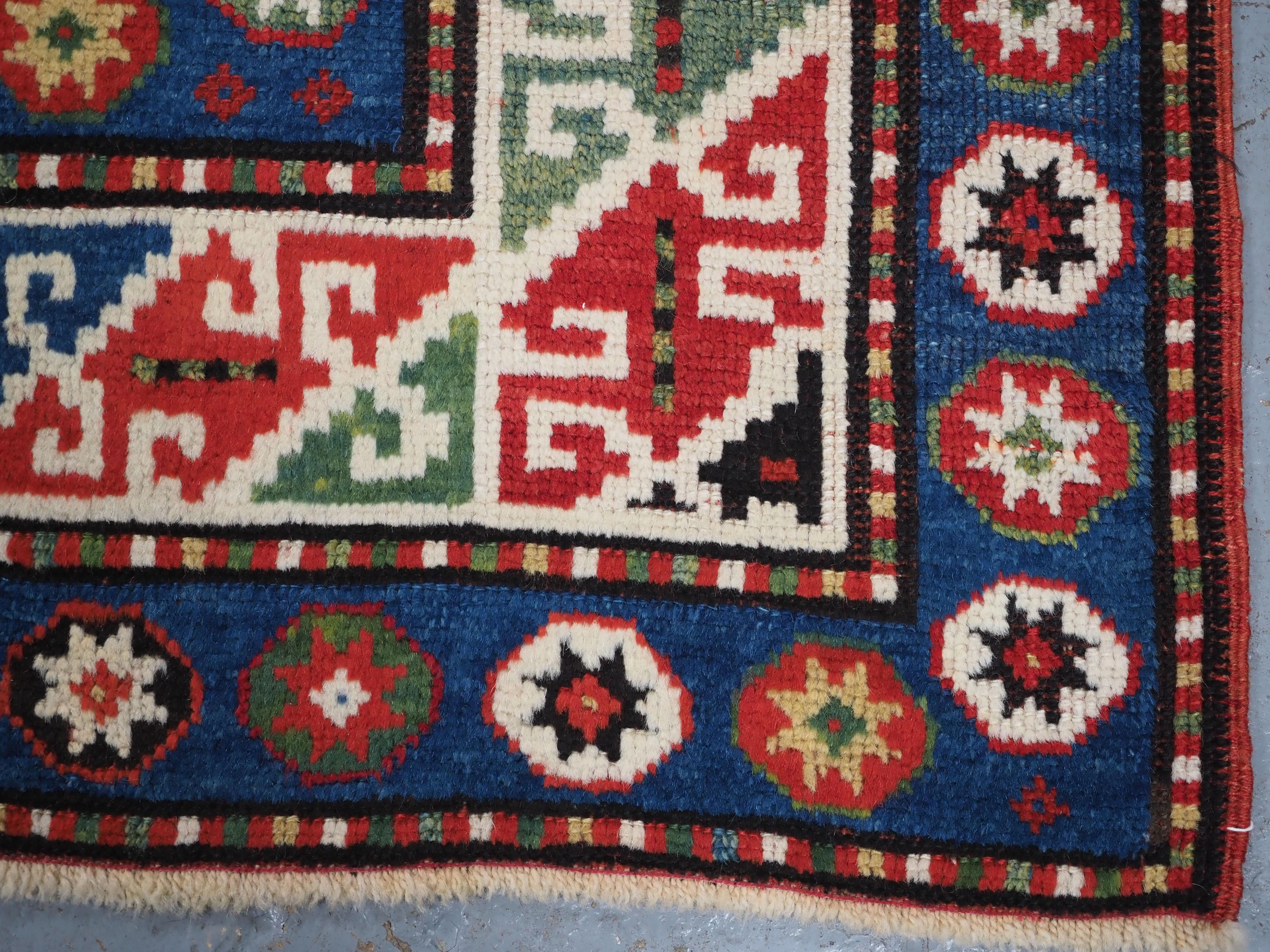 Antique Caucasian Kazak rug with a single column of boxed 'Memlinc guls'. For Sale 7
