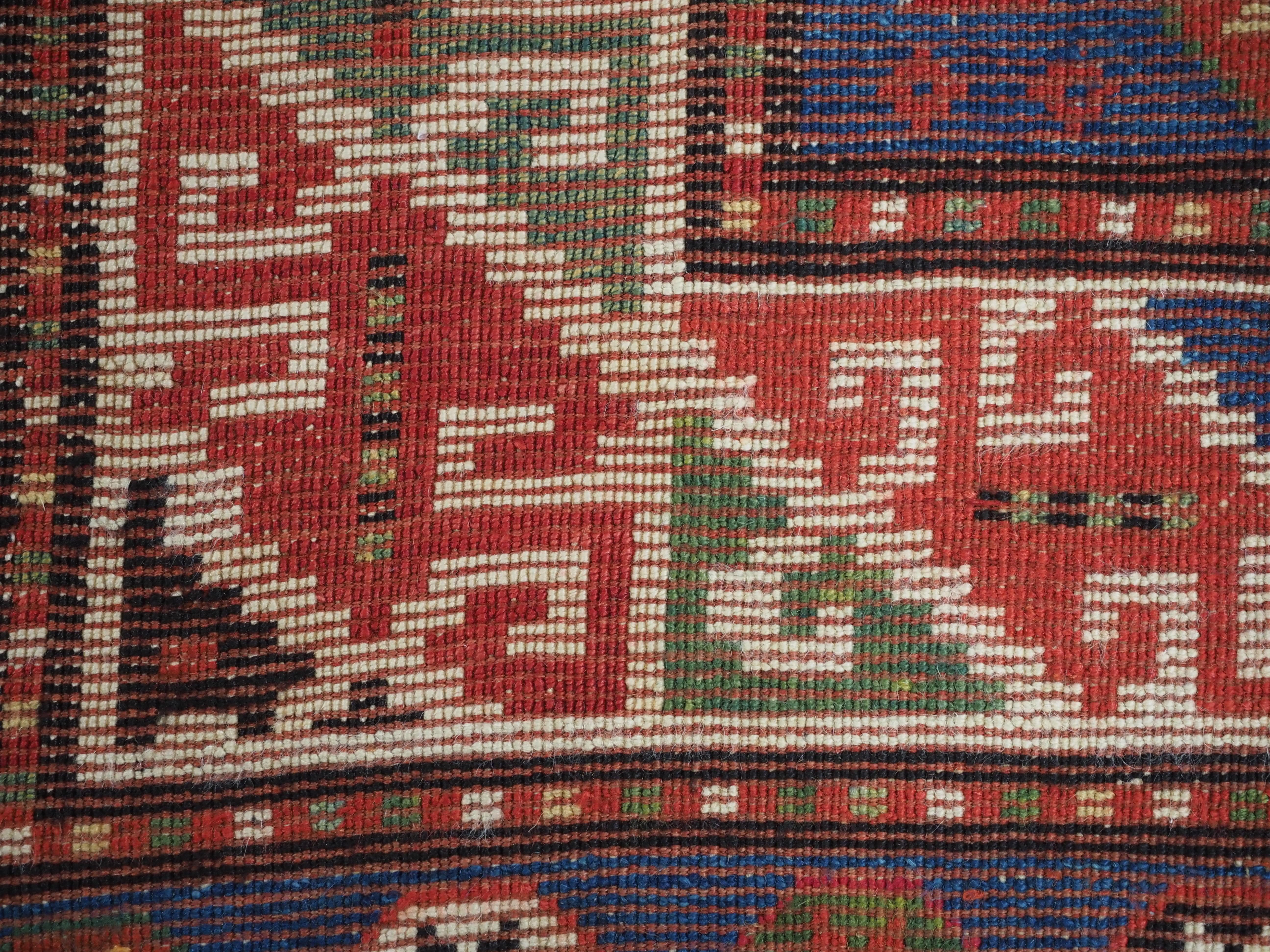 Antique Caucasian Kazak rug with a single column of boxed 'Memlinc guls'. For Sale 8