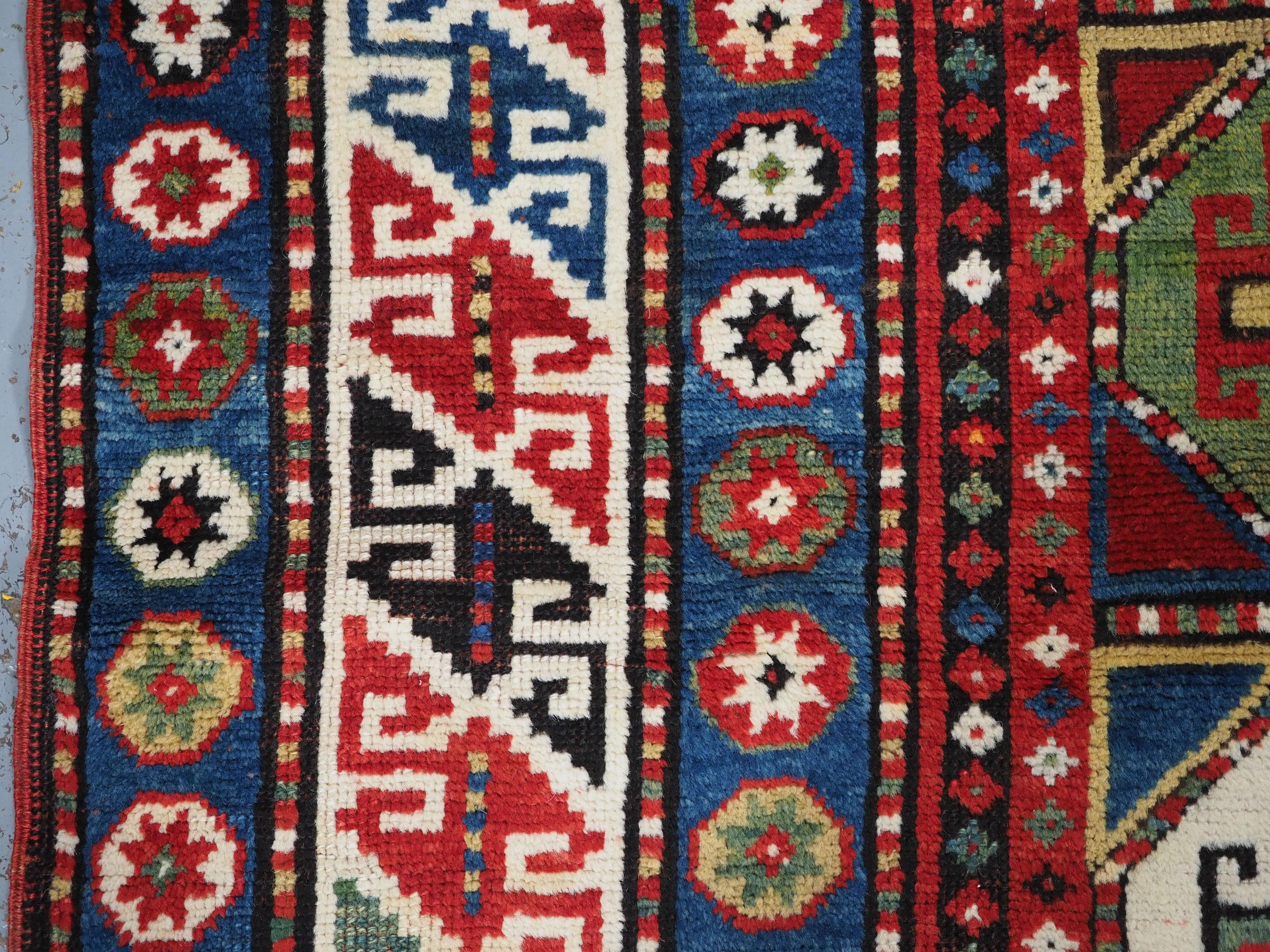 Antique Caucasian Kazak rug with a single column of boxed 'Memlinc guls'. For Sale 2