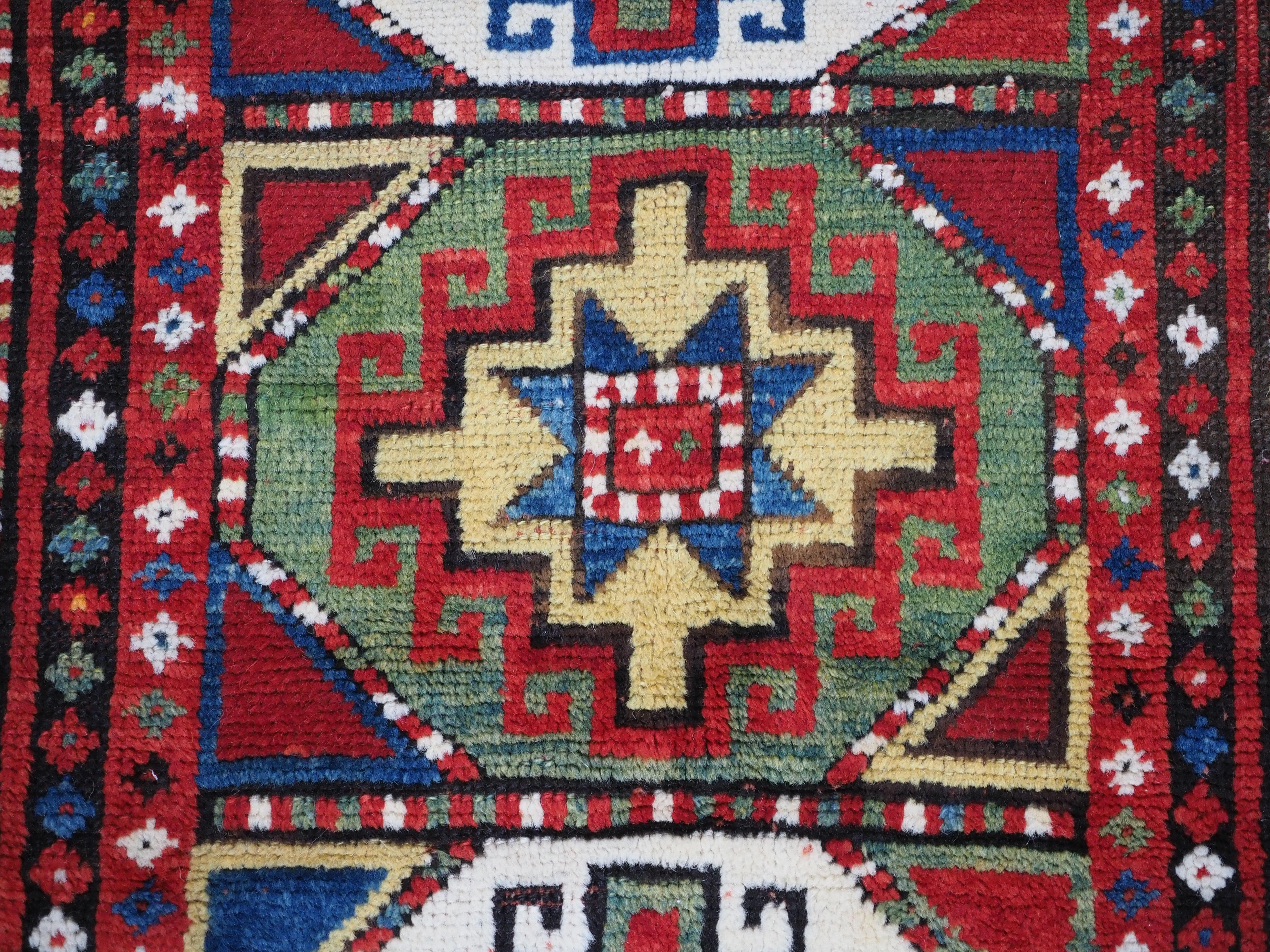 Antique Caucasian Kazak rug with a single column of boxed 'Memlinc guls'. For Sale 4