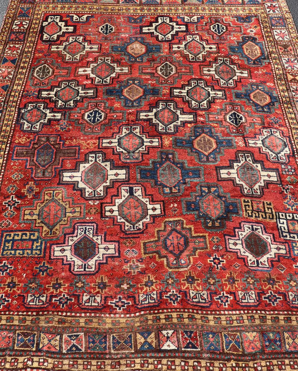 Antique Caucasian Kazak Rug with All-Over Tribal and Medallion Design In Good Condition For Sale In Atlanta, GA