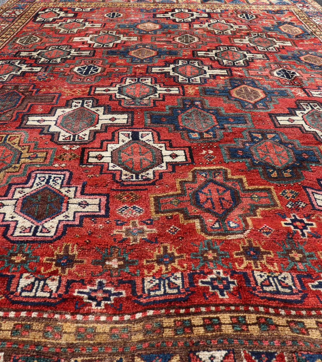 Early 20th Century Antique Caucasian Kazak Rug with All-Over Tribal and Medallion Design For Sale