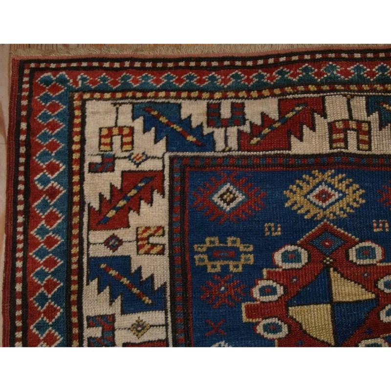 A 19th century Caucasian Kazak rug of bold medallion design with animals to the blue field. The border is of a classic Kazak design. The rug has a very ‘rustic’ village feel to it that adds a great deal of charm.

The rug is in good condition with