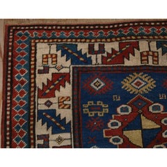 Antique Caucasian Kazak Rug with Bold Animal Design