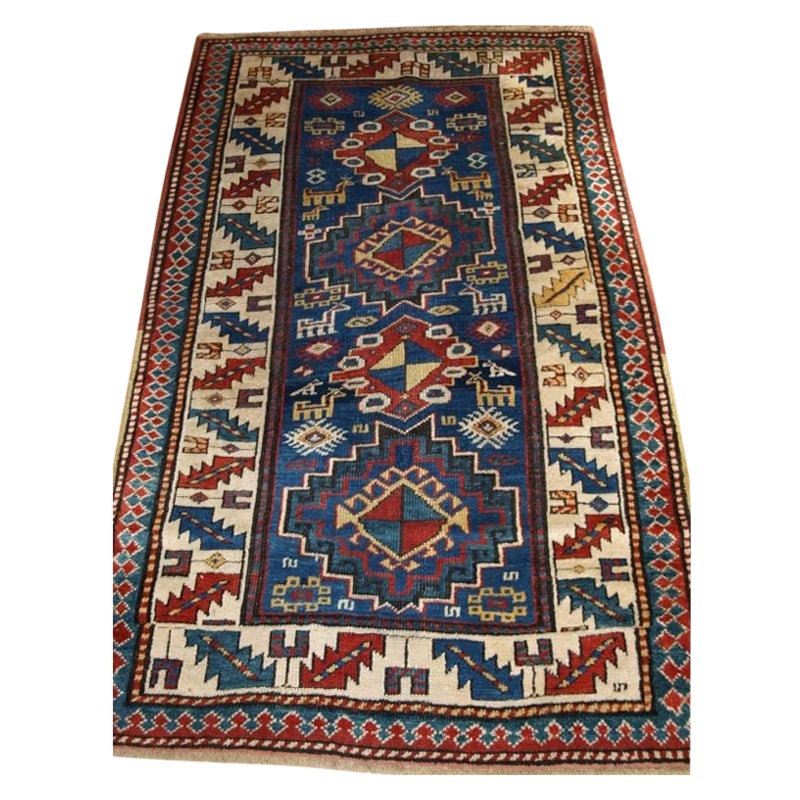 Antique Caucasian Kazak Rug with Bold Animal Design